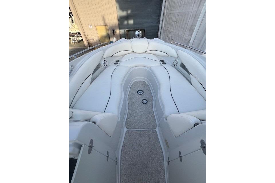 2007 Crownline 320 LS boat interior with white seating and carpeted floor.