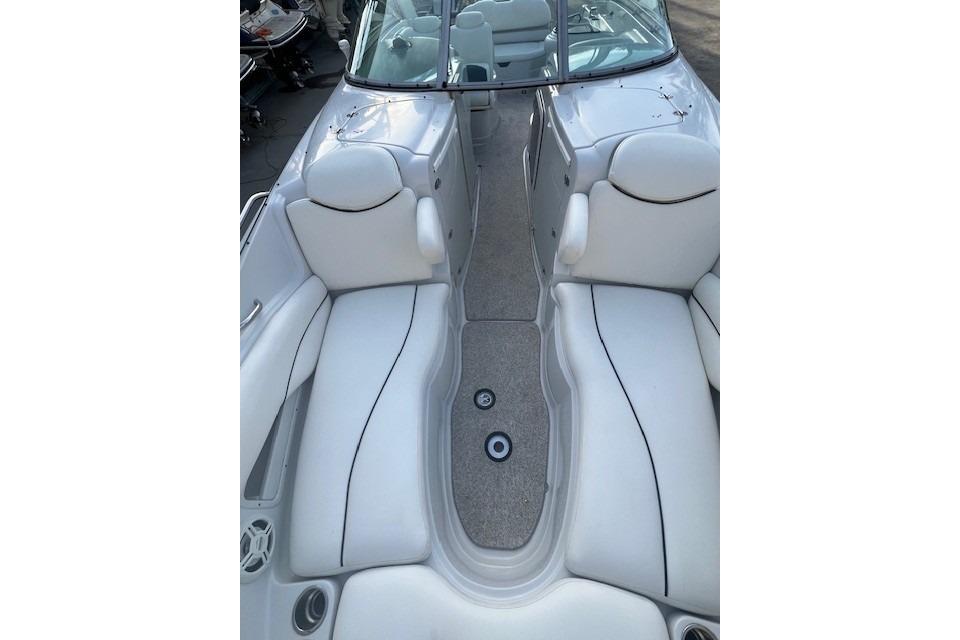 2007 Crownline 320 LS boat interior with white seating and open deck layout.