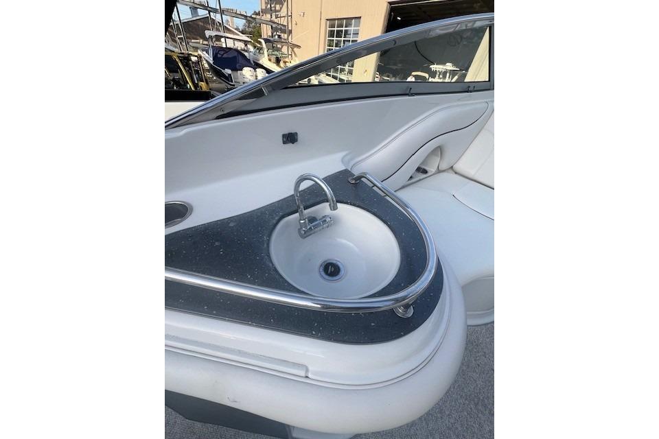 2007 Crownline 320 LS boat interior with sleek sink and seating area.