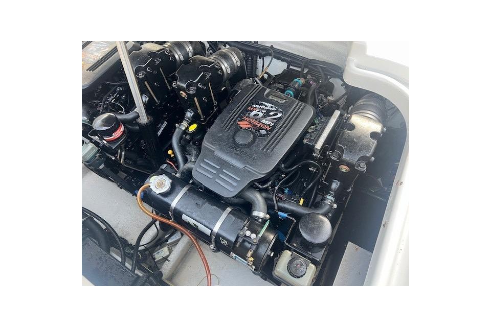 Engine of 2007 Crownline 320 LS boat, showcasing detailed components and layout.