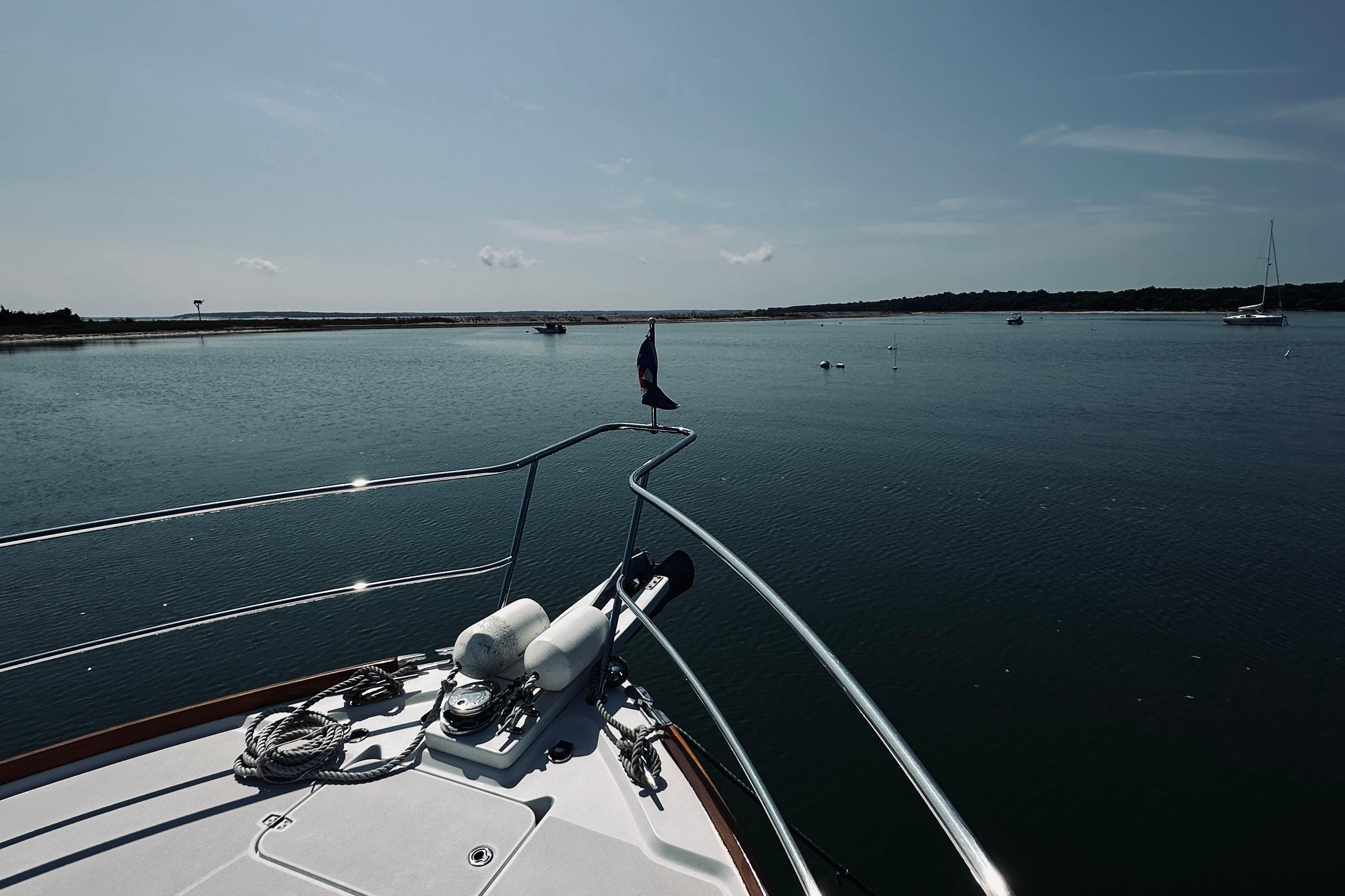 2007 Sabreline 34 Express yacht on calm waters under a clear sky.