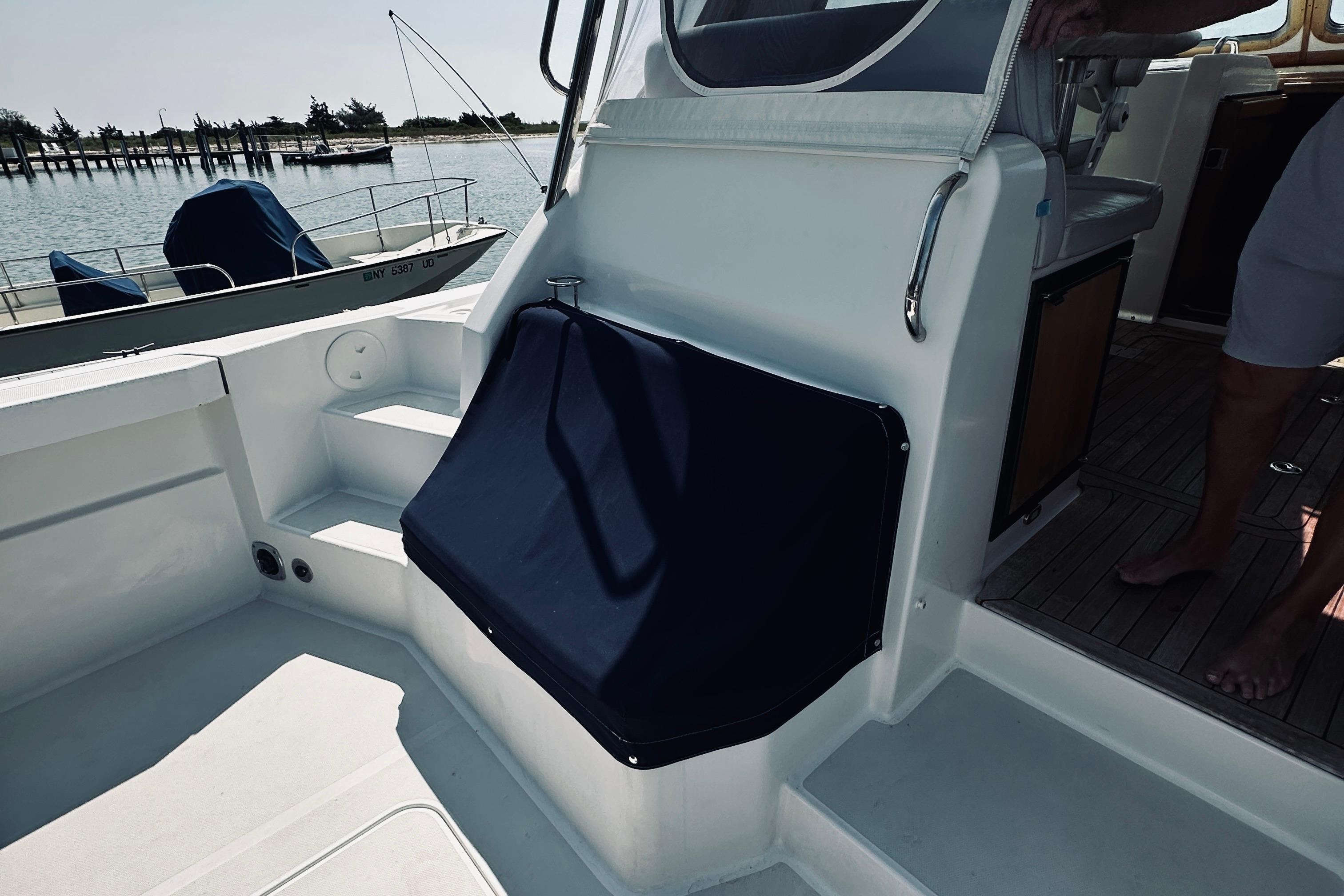 2007 Sabreline 34 Express boat interior with seating and deck view.
