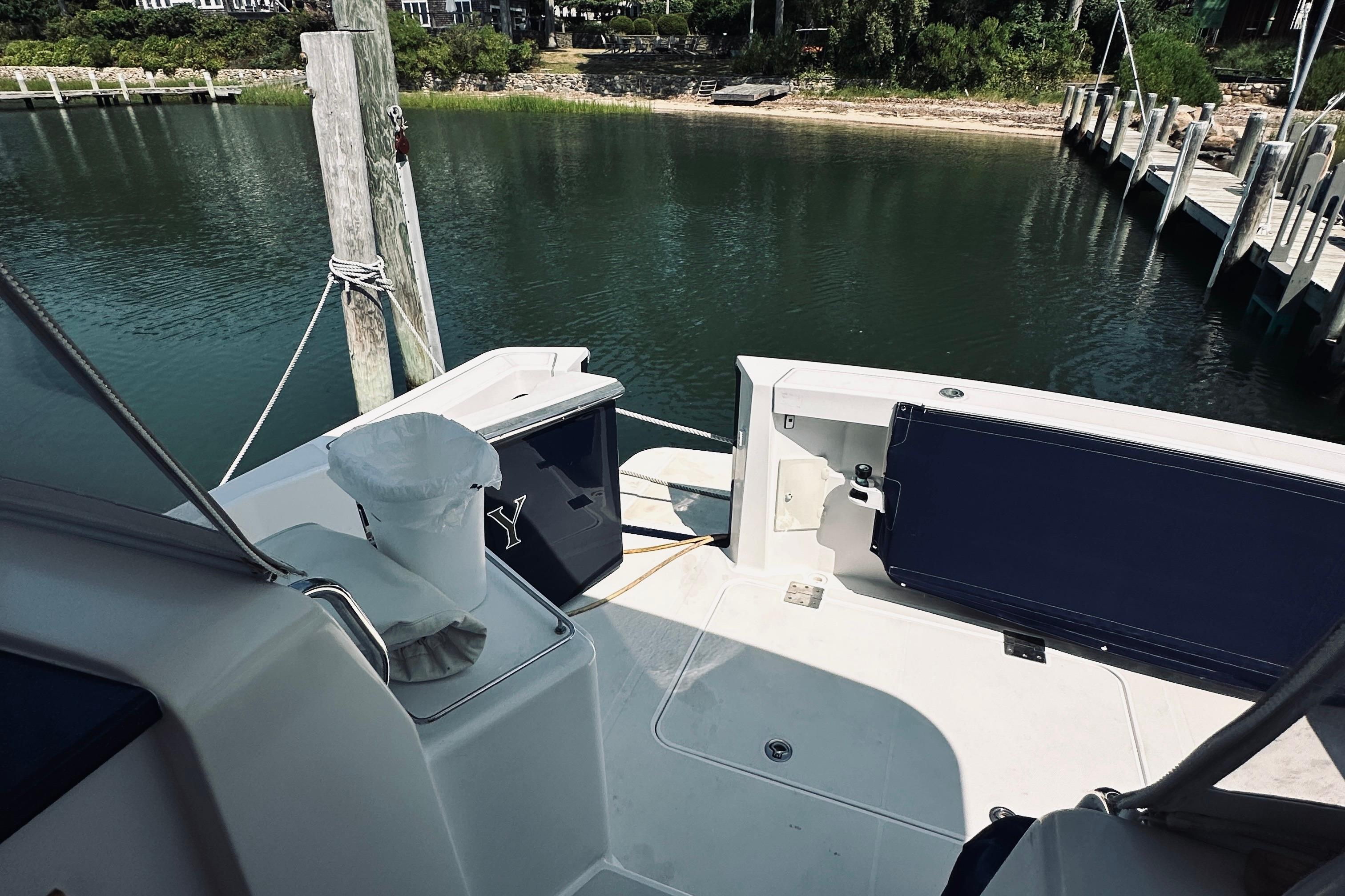 2007 Sabreline 34 Express boat docked in a serene marina setting.