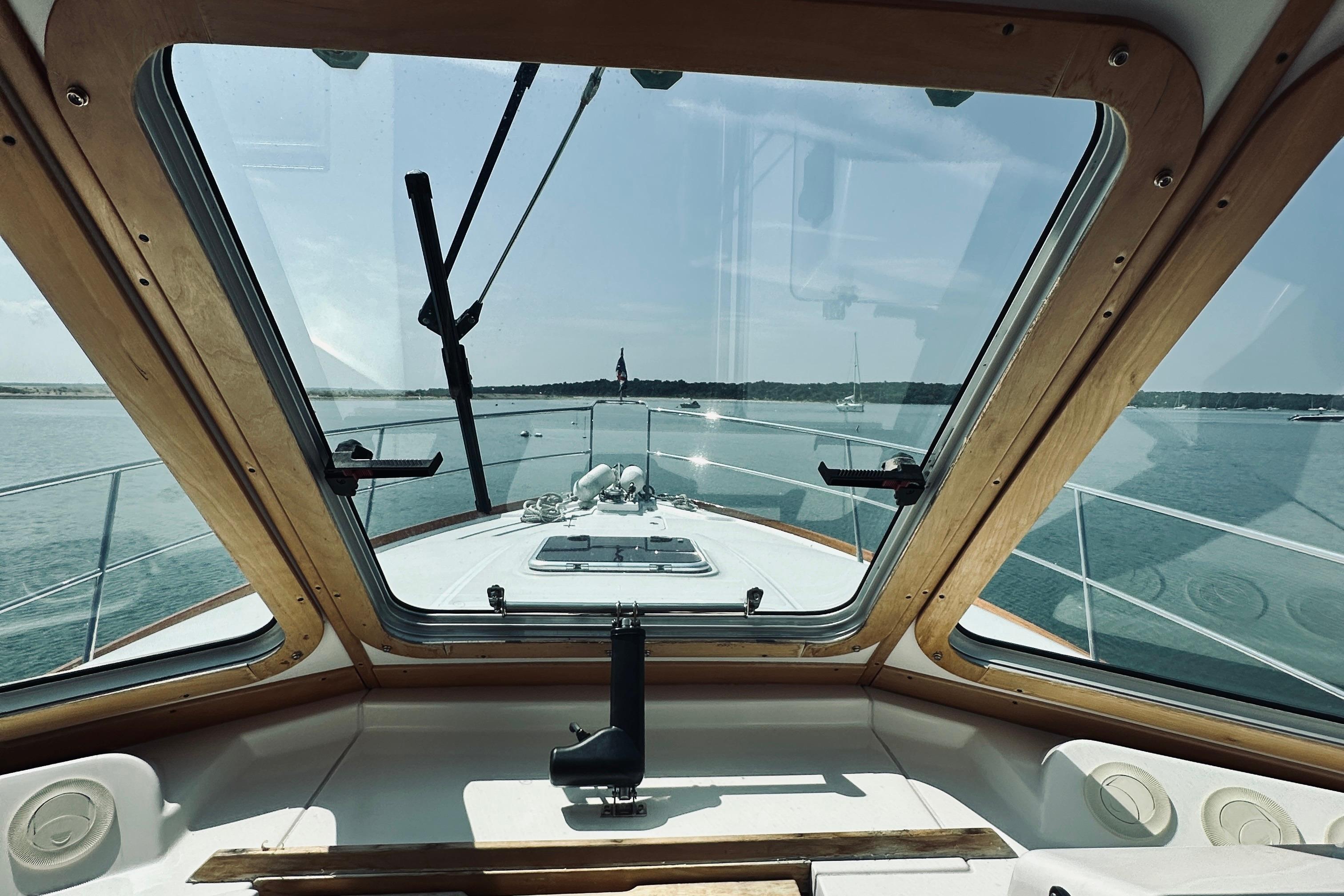 2007 Sabreline 34 Express boat interior view through windshield on calm water.