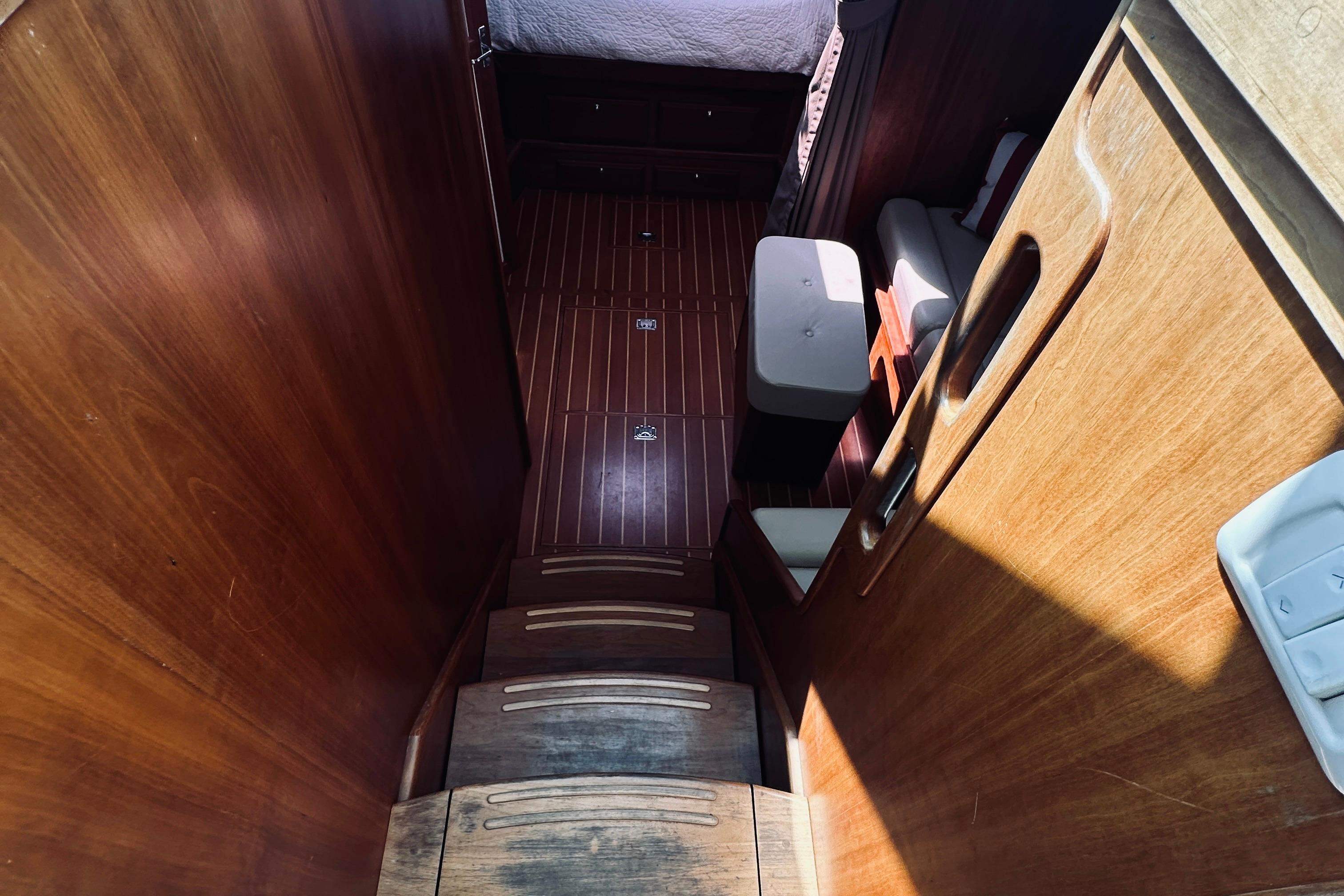 Interior view of 2007 Sabreline 34 Express, featuring wooden stairs and cabin area.