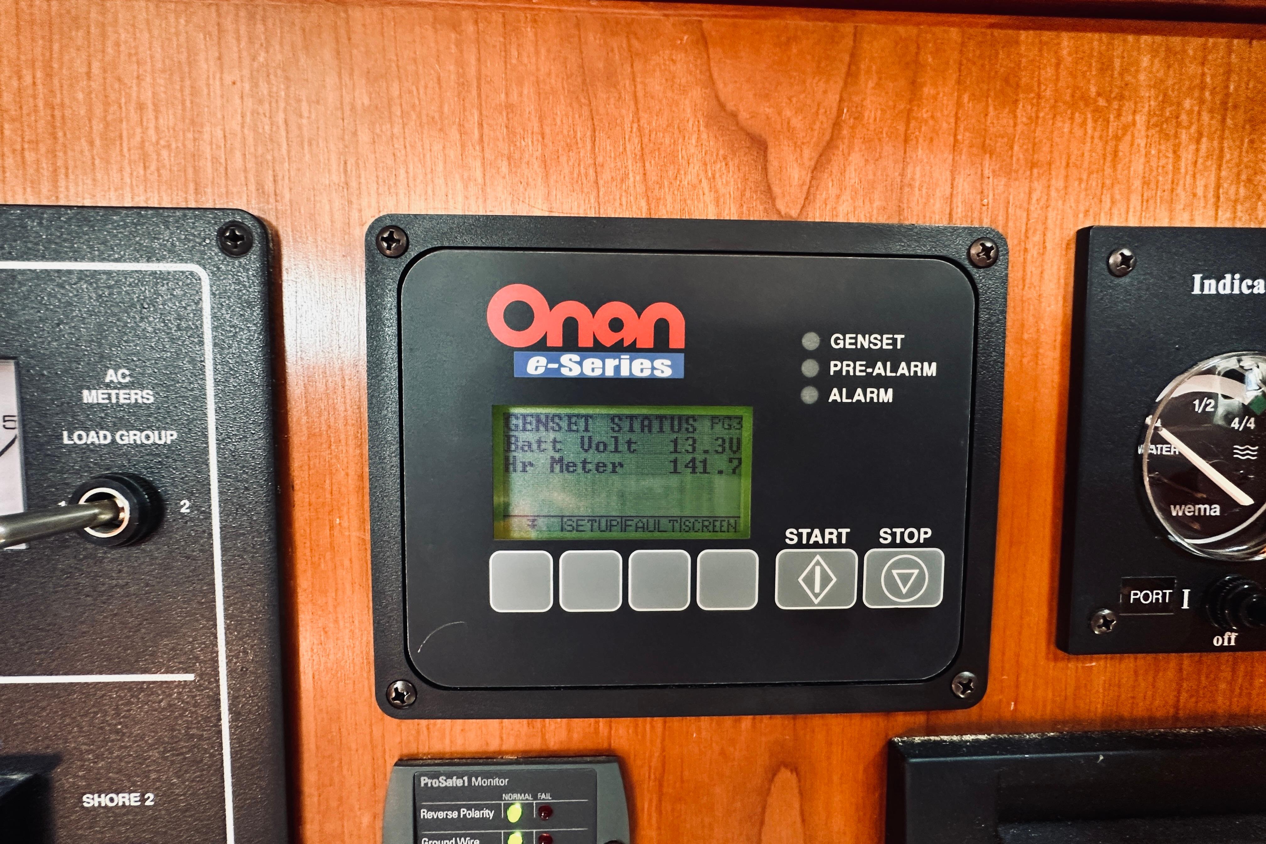 Onan e-Series control panel on 2007 Sabreline 34 Express boat dashboard.