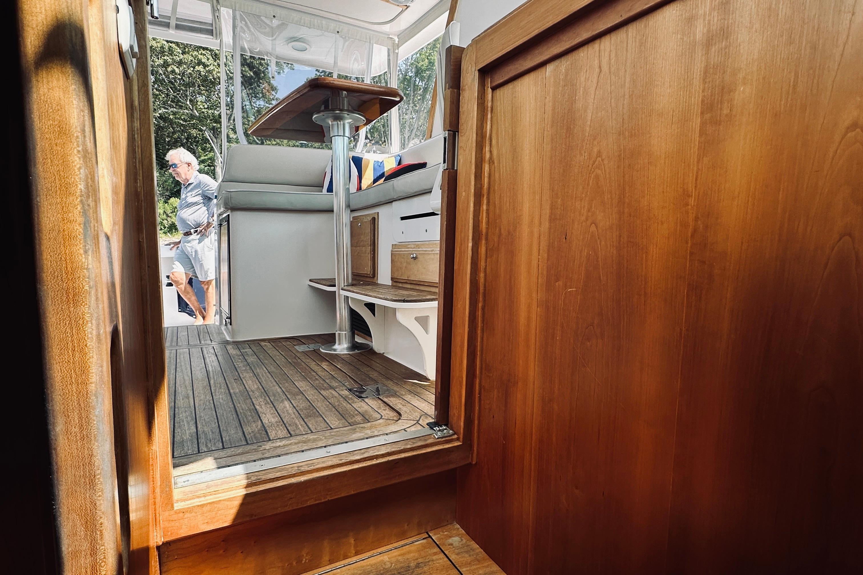 2007 Sabreline 34 Express interior with wooden finish and outdoor view.