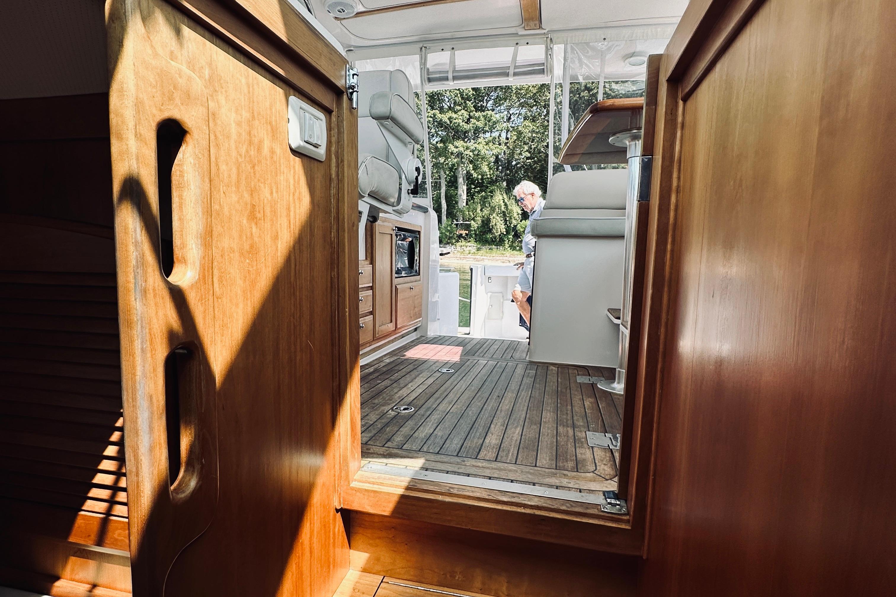 2007 Sabreline 34 Express interior with wooden finish and open deck view.