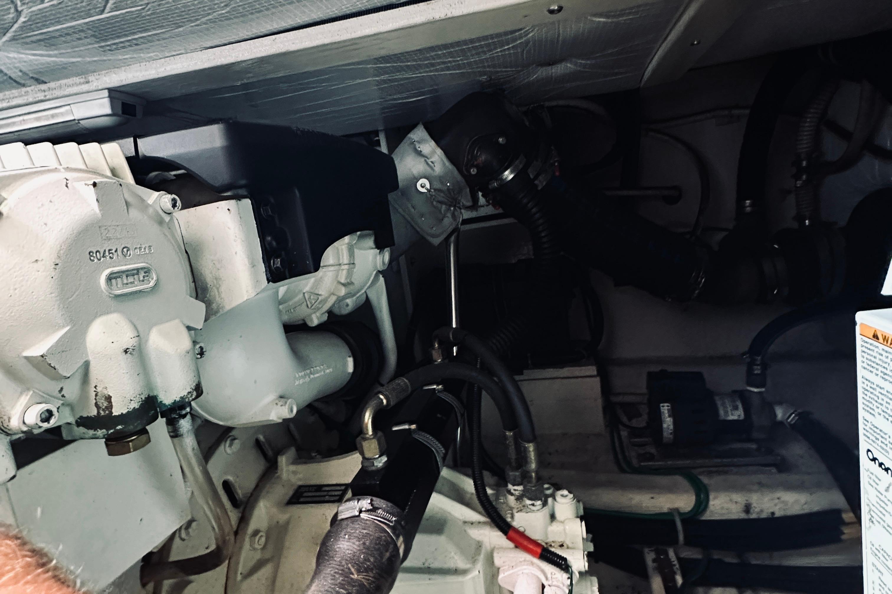 Engine compartment of a 2007 Sabreline 34 Express boat, showcasing mechanical components.