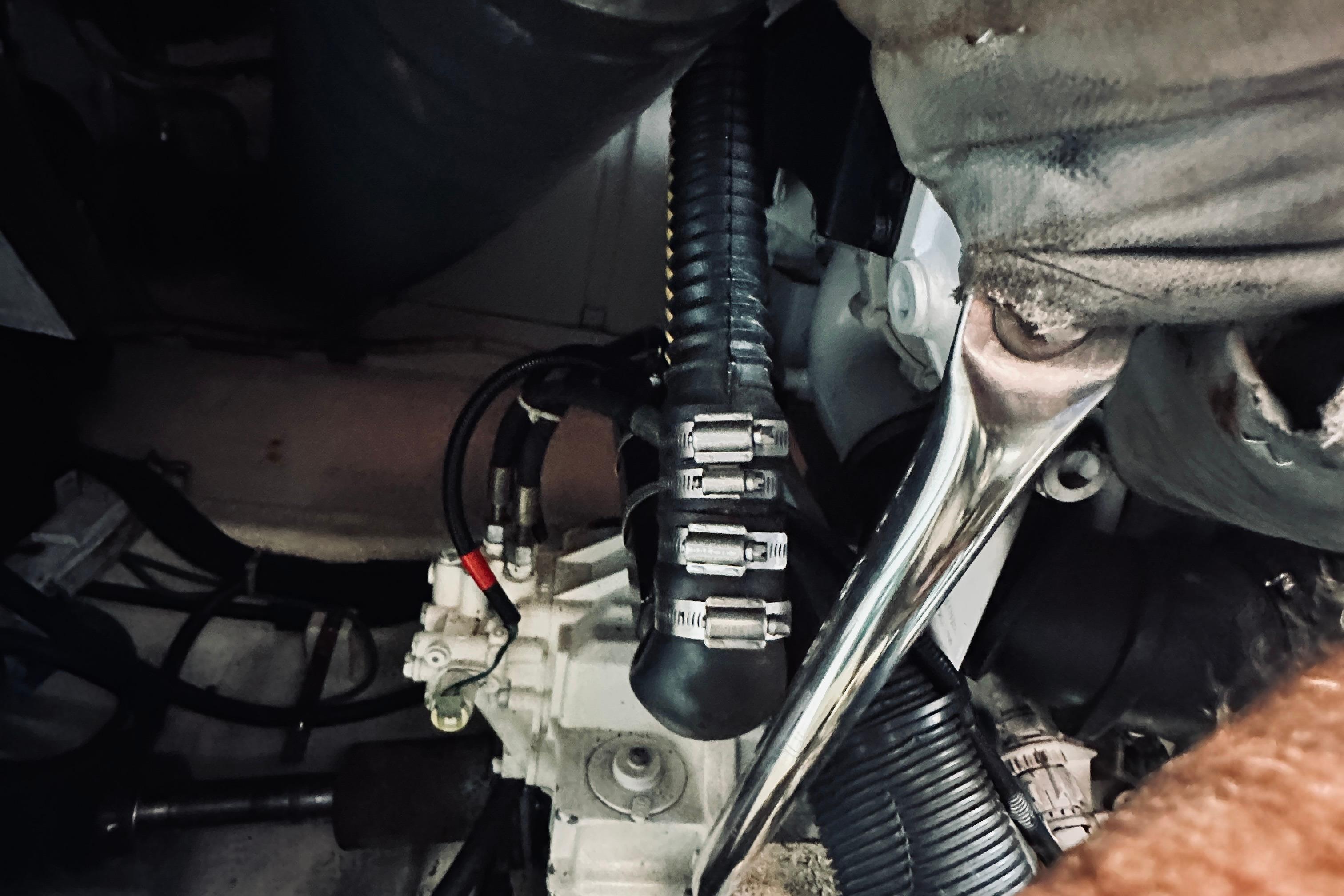 Engine compartment of a 2007 Sabreline 34 Express boat, showing hoses and mechanical components.