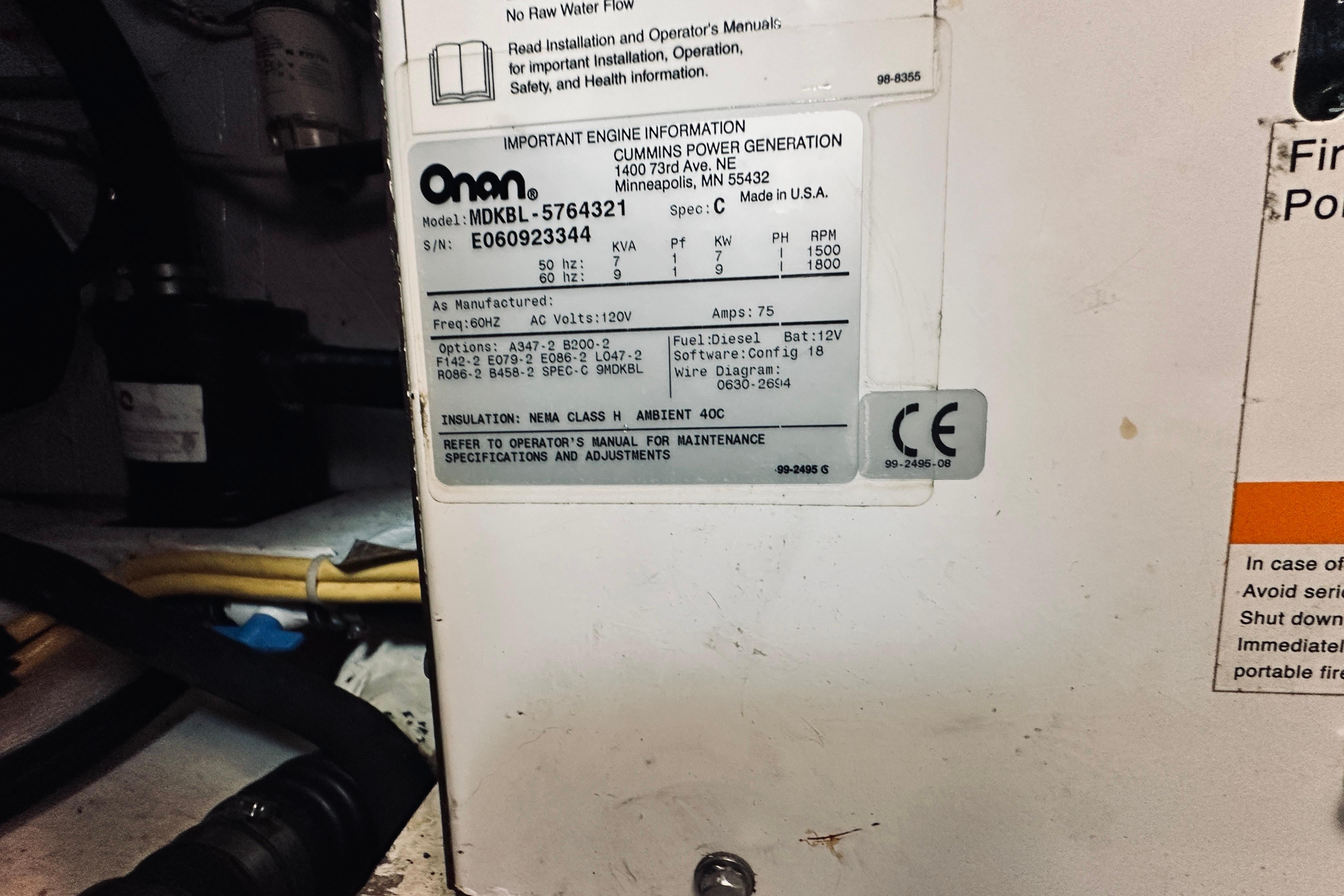 Onan generator label inside 2007 Sabreline 34 Express boat engine compartment.
