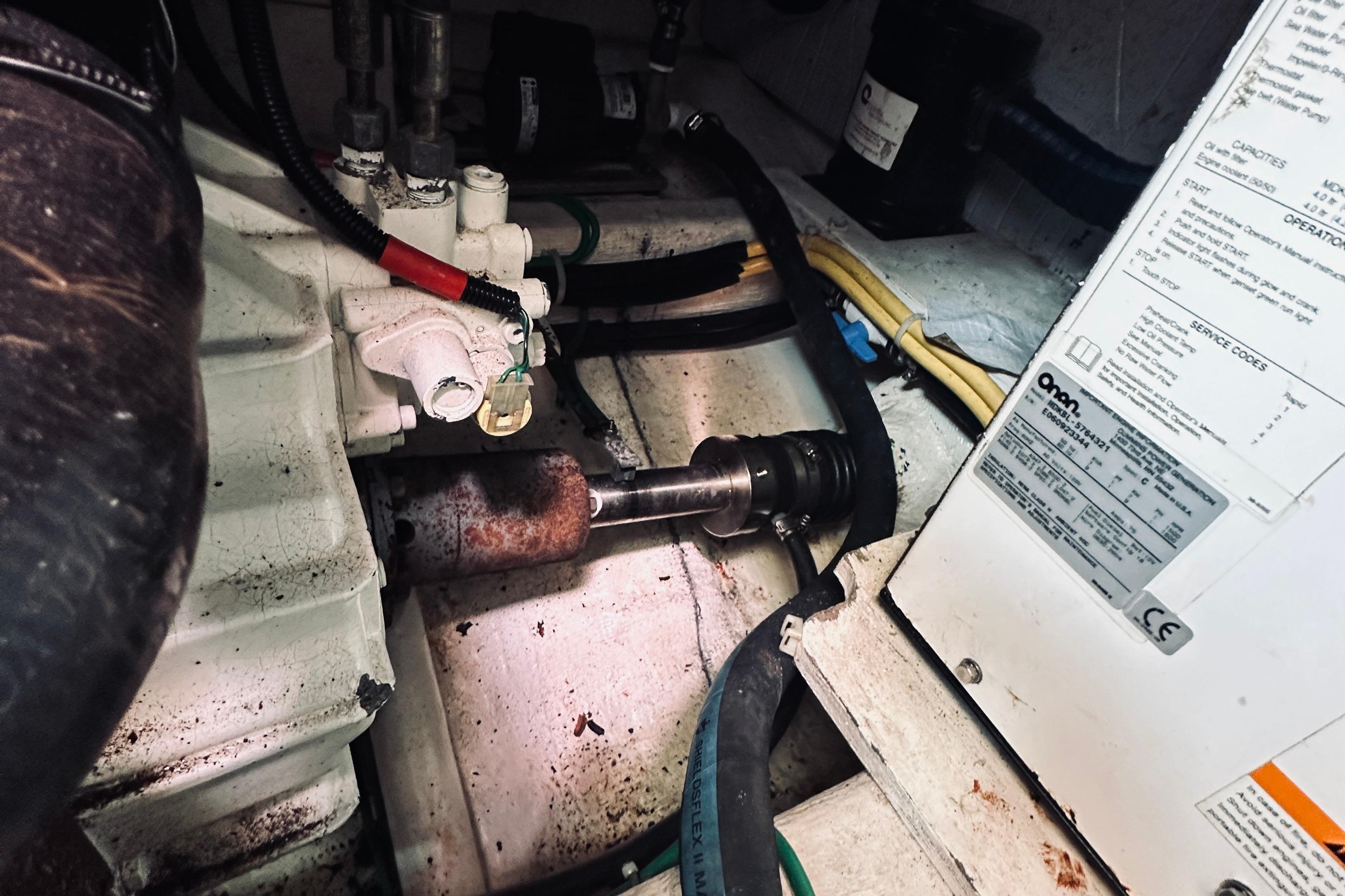 Engine compartment of a 2007 Sabreline 34 Express, showing mechanical components and wiring.