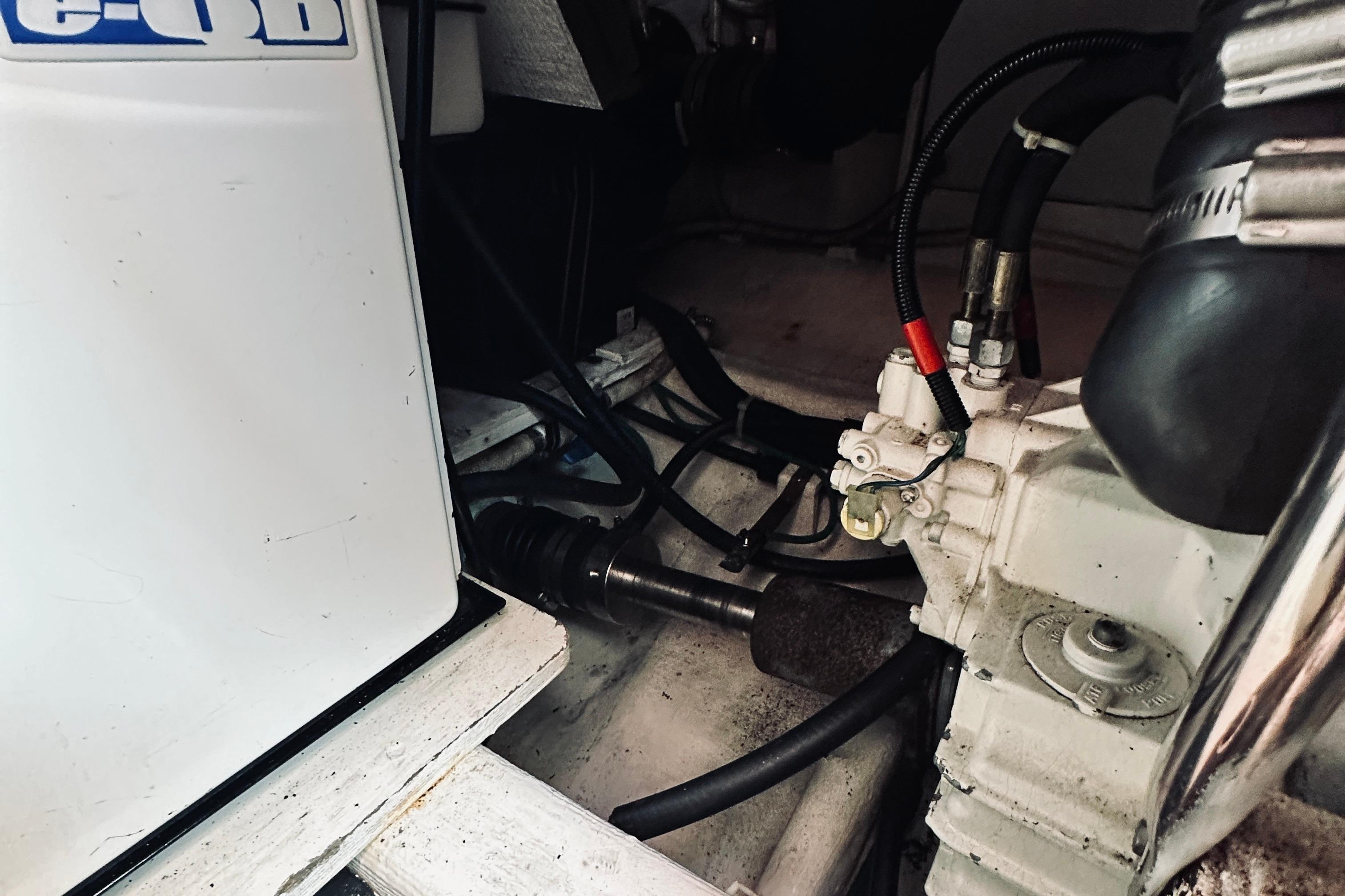 Engine compartment of a 2007 Sabreline 34 Express boat, showing mechanical components and wiring.