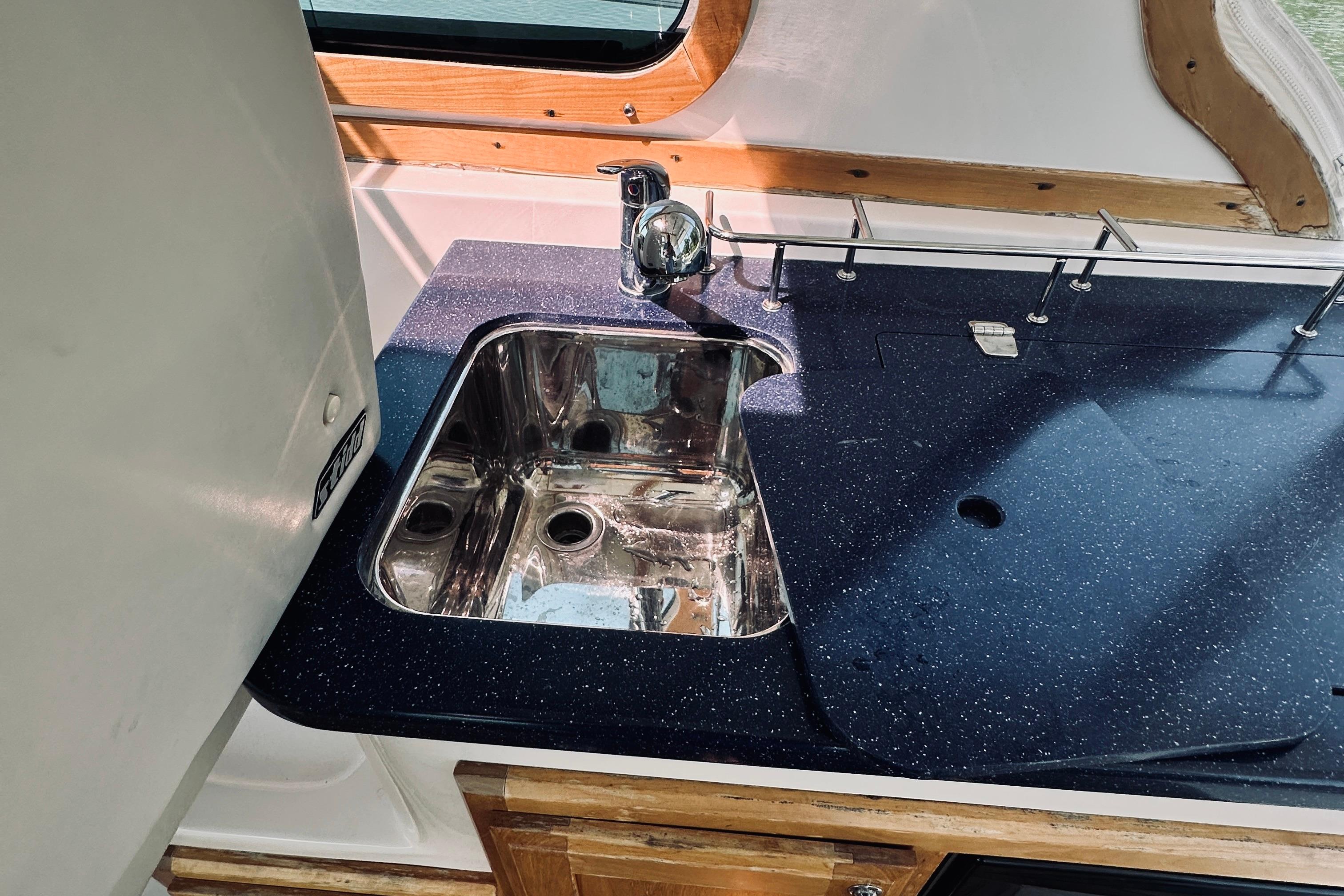 2007 Sabreline 34 Express yacht kitchen sink with sleek countertop design.