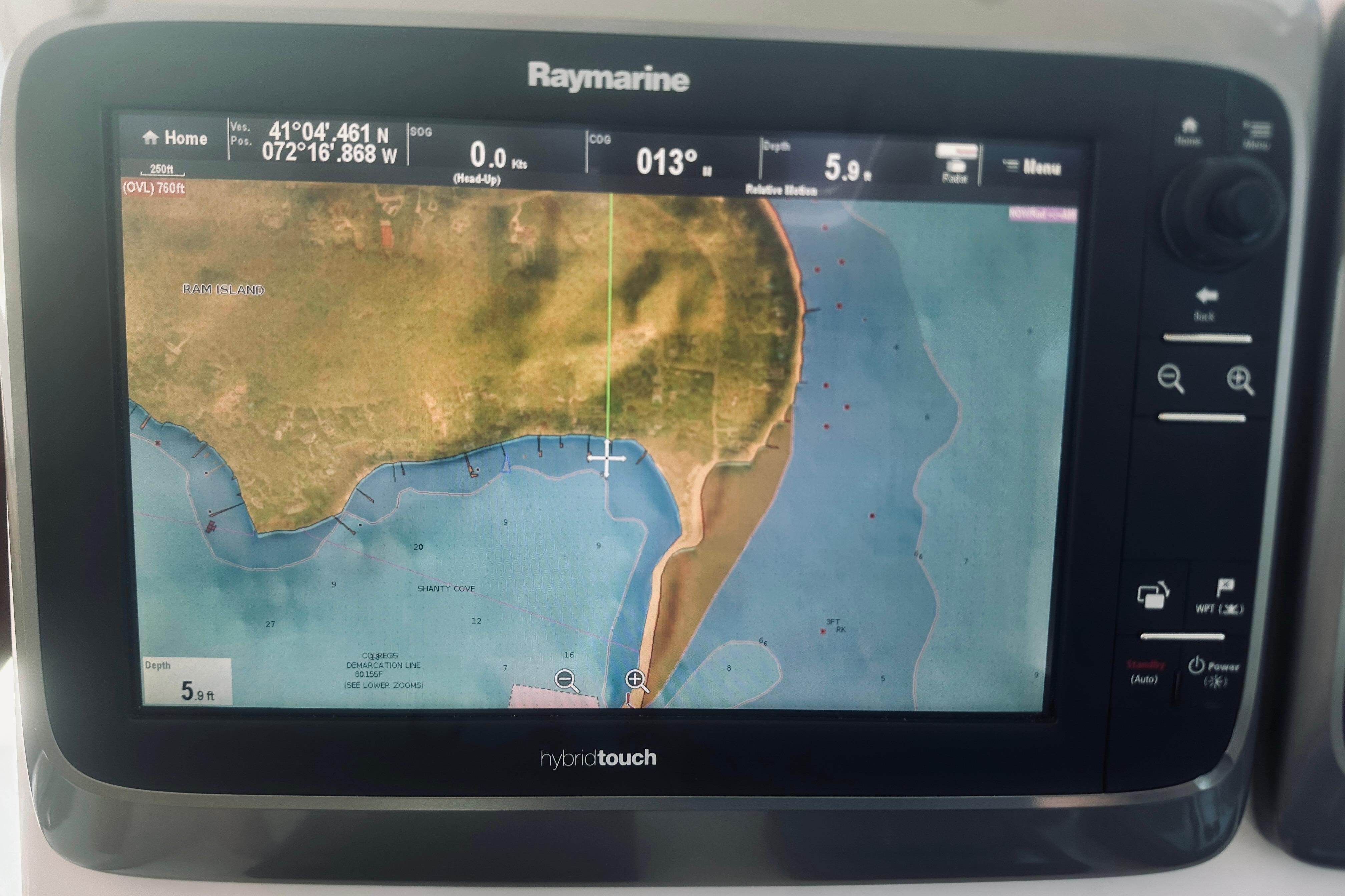 Raymarine navigation display on 2007 Sabreline 34 Express, showing coastal map and coordinates.