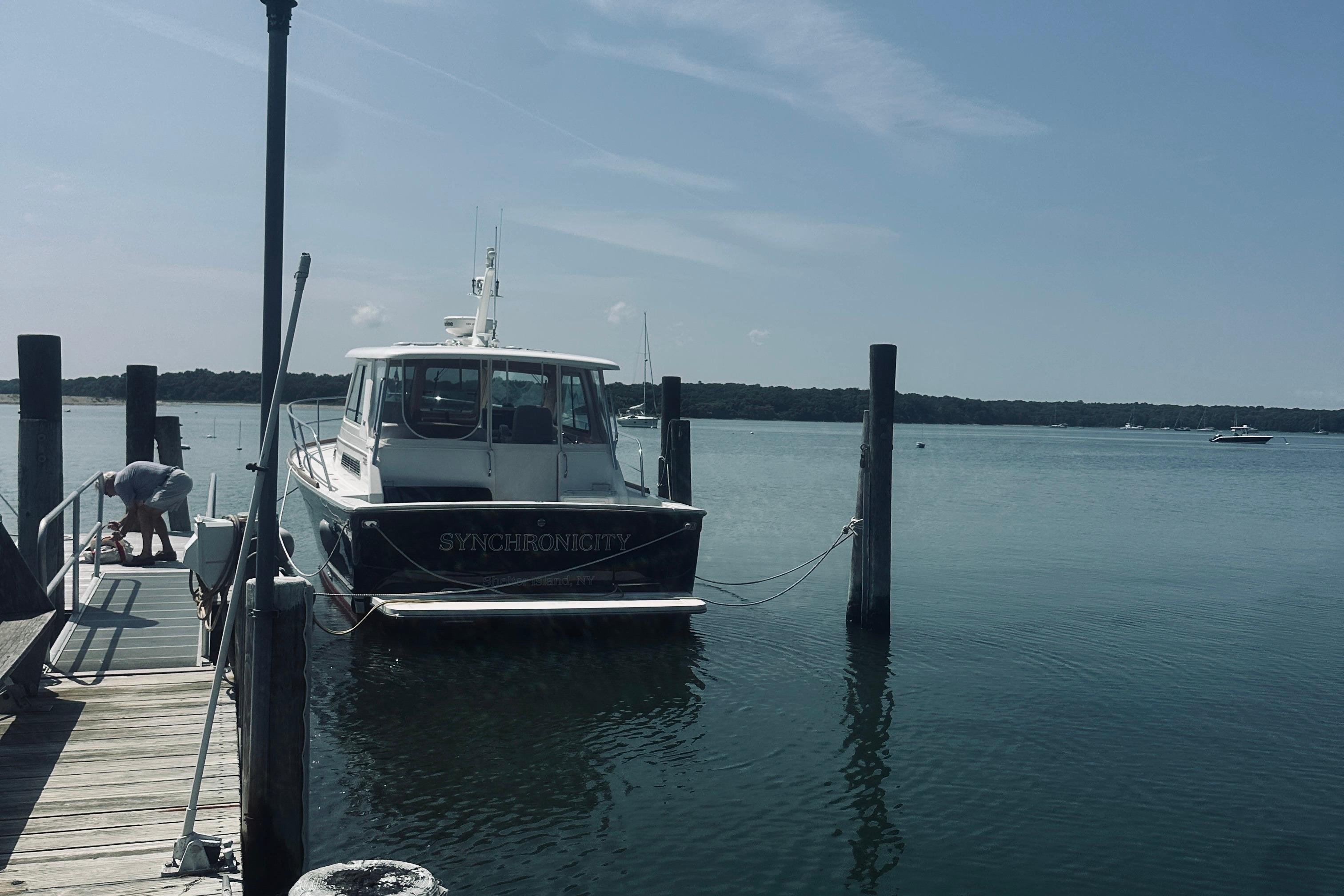 2007 Sabreline 34 Express boat docked at a serene marina.
