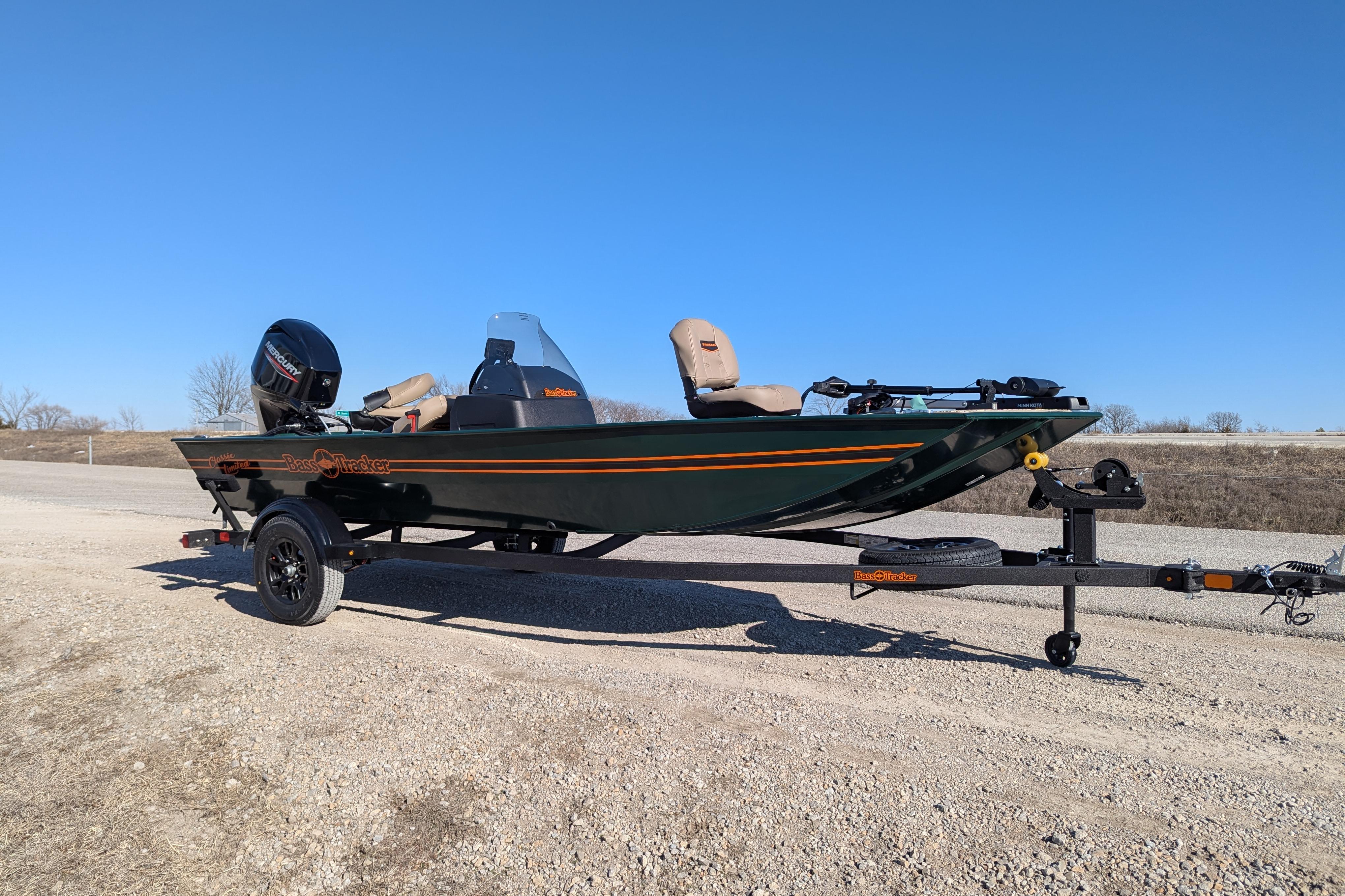2025 Tracker Bass Tracker Classic Limited boat on trailer, parked on gravel road.