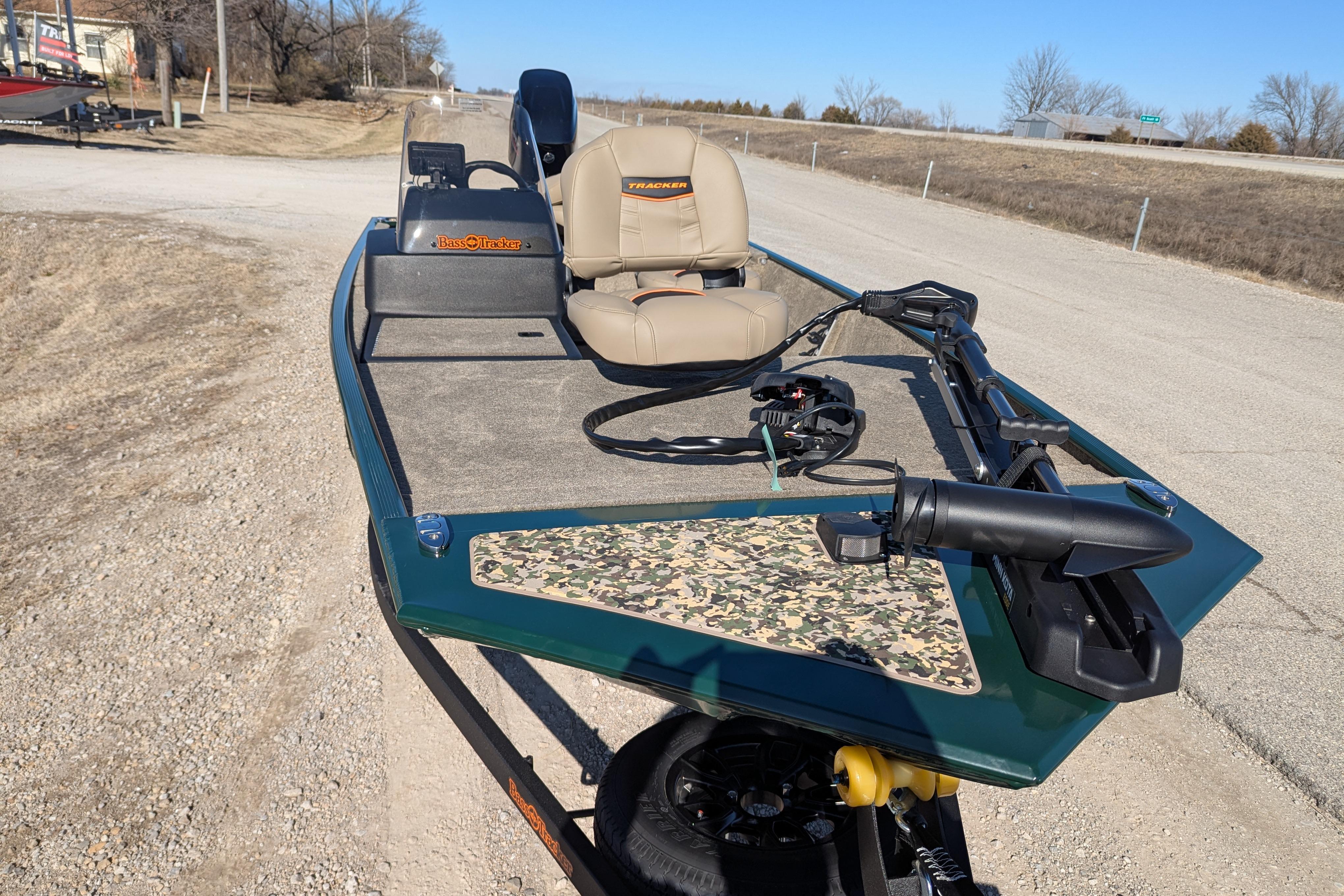 2025 Tracker Bass Tracker Classic Limited boat on a rural road, featuring camo accents.