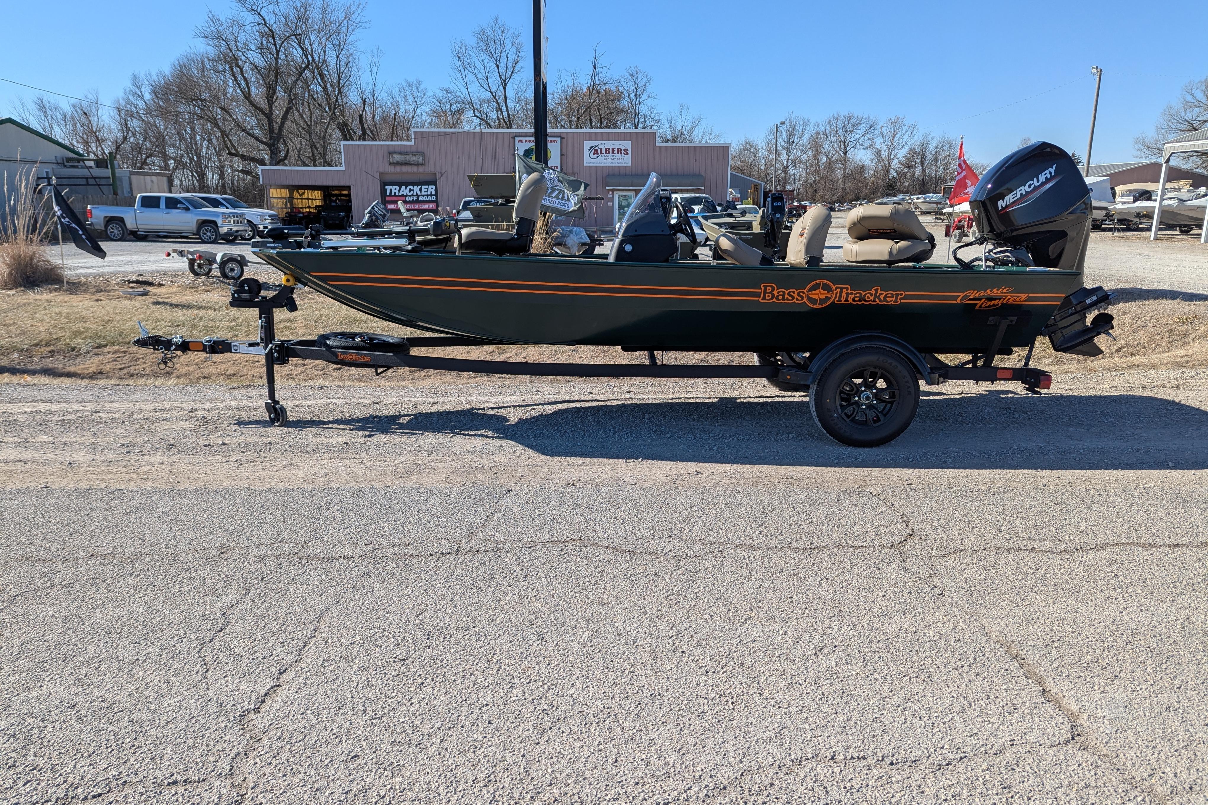 2025 Tracker Bass Tracker Classic Limited boat on trailer, parked outdoors.