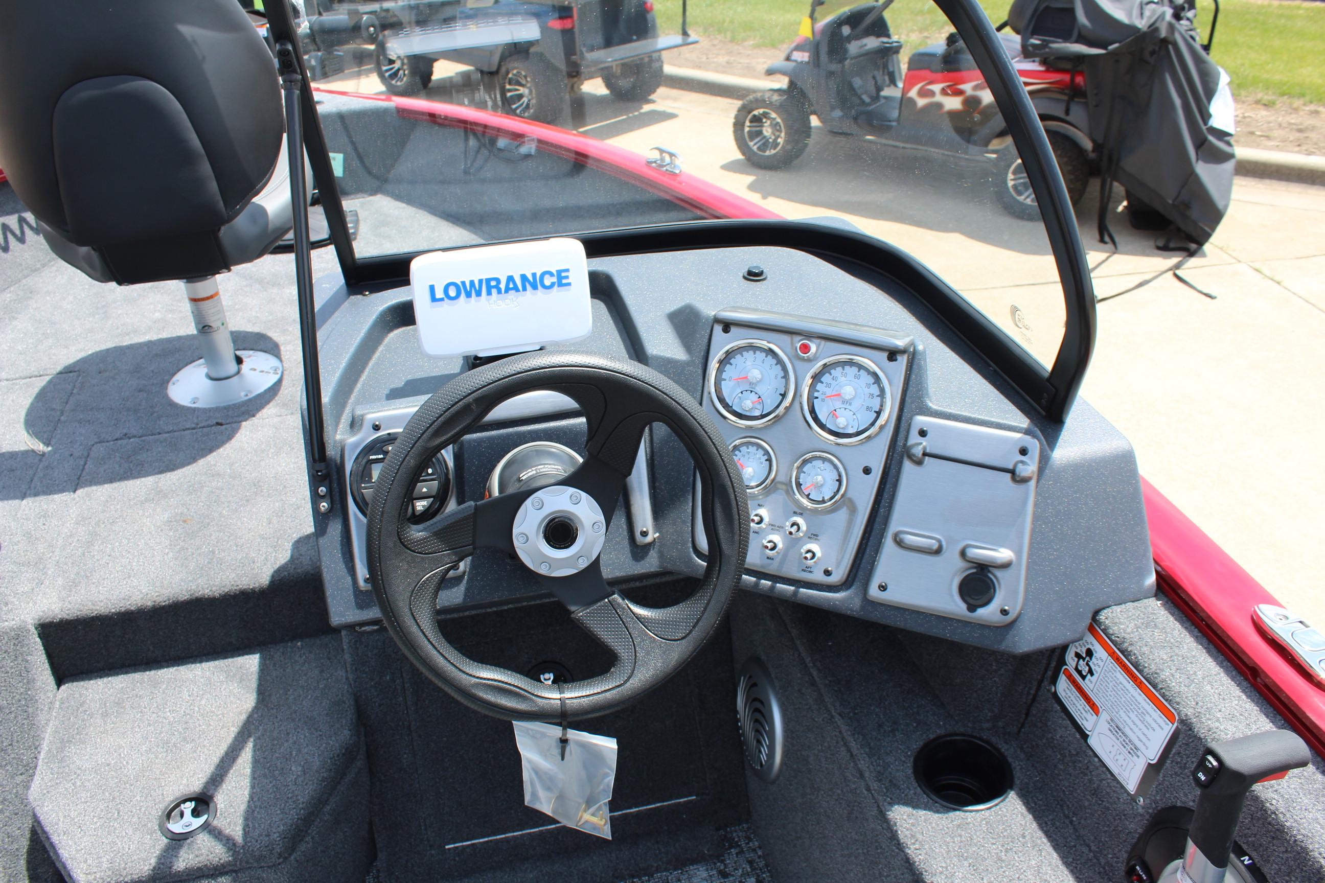 2025 Tracker Pro Guide V-175 Combo boat dashboard with steering wheel and gauges.
