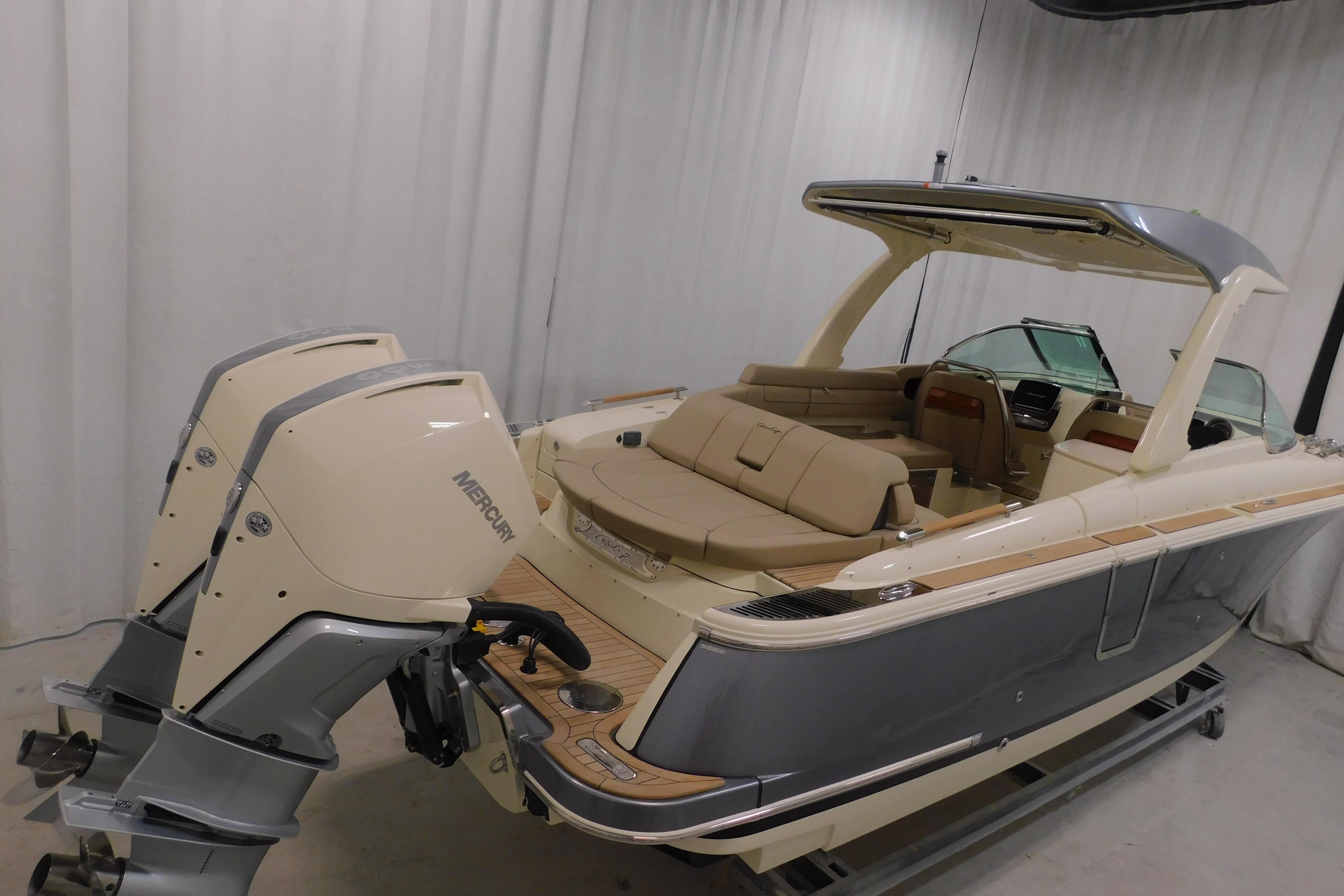 2024 Chris-Craft Launch 31 GT boat with dual Mercury engines, elegant interior design.