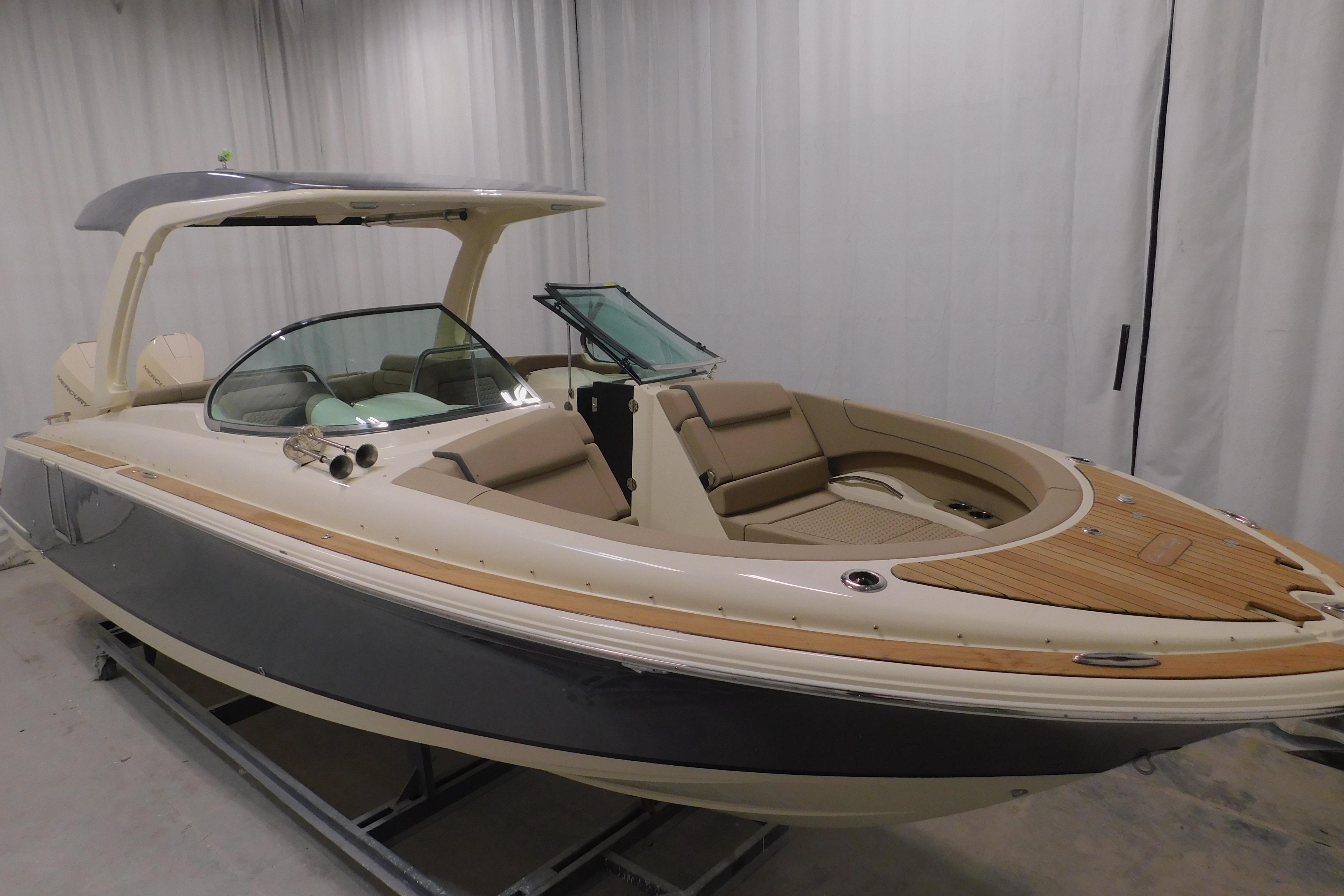 2024 Chris-Craft Launch 31 GT boat with sleek design and luxurious seating.