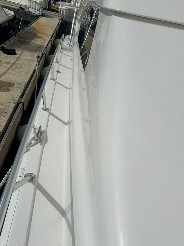 Bertram-510 Convertible 2002 -PR-Side view of a 2002 Bertram 510 Convertible yacht docked at a marina.-9177717 | Thumbnail
