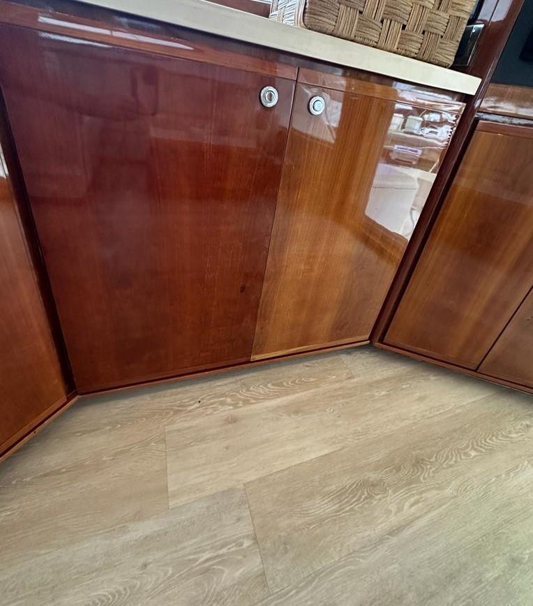 Bertram-510 Convertible 2002 -PR-2002 Bertram 510 Convertible yacht interior with polished wooden cabinets and light wood flooring.-9177717 | Thumbnail
