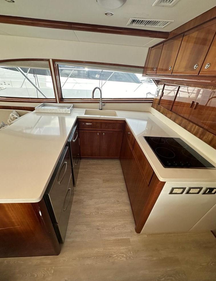 Bertram-510 Convertible 2002 -PR-Modern kitchen on a 2002 Bertram 510 Convertible yacht with sleek countertops.-9177717 | Thumbnail