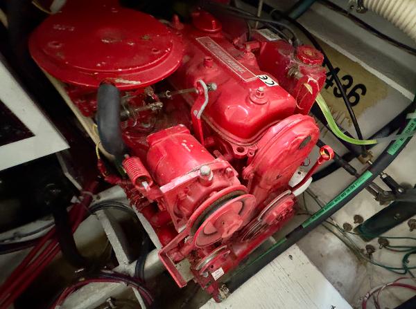 Engine of 1998 Bayliner 3388 Command Bridge Motoryacht, vibrant red, detailed view.