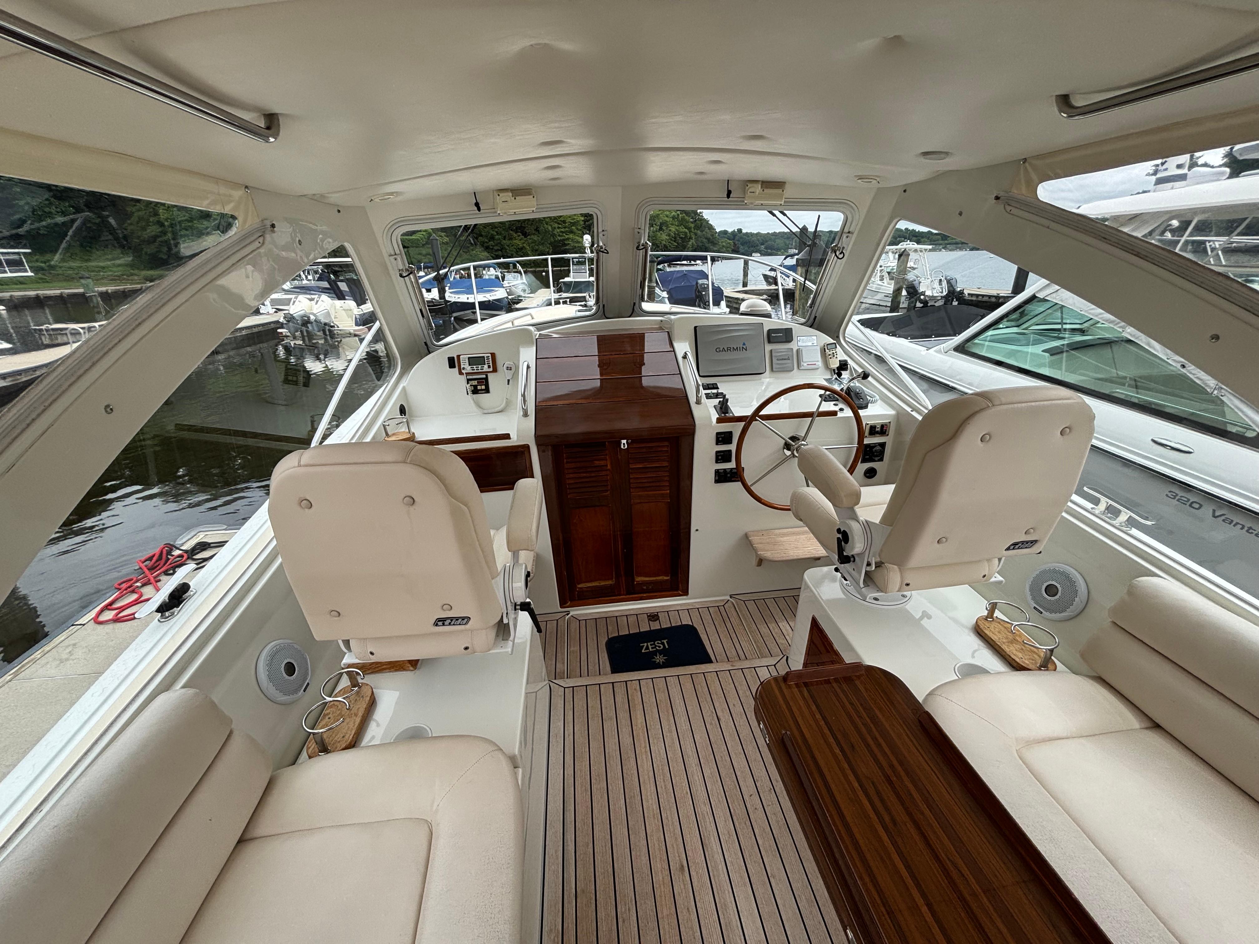 MJM-34z Express HT 2006-Zest MD-US-2006 MJM 34z Express HT yacht interior with helm, wooden accents, and plush seating.-9817750 | Thumbnail