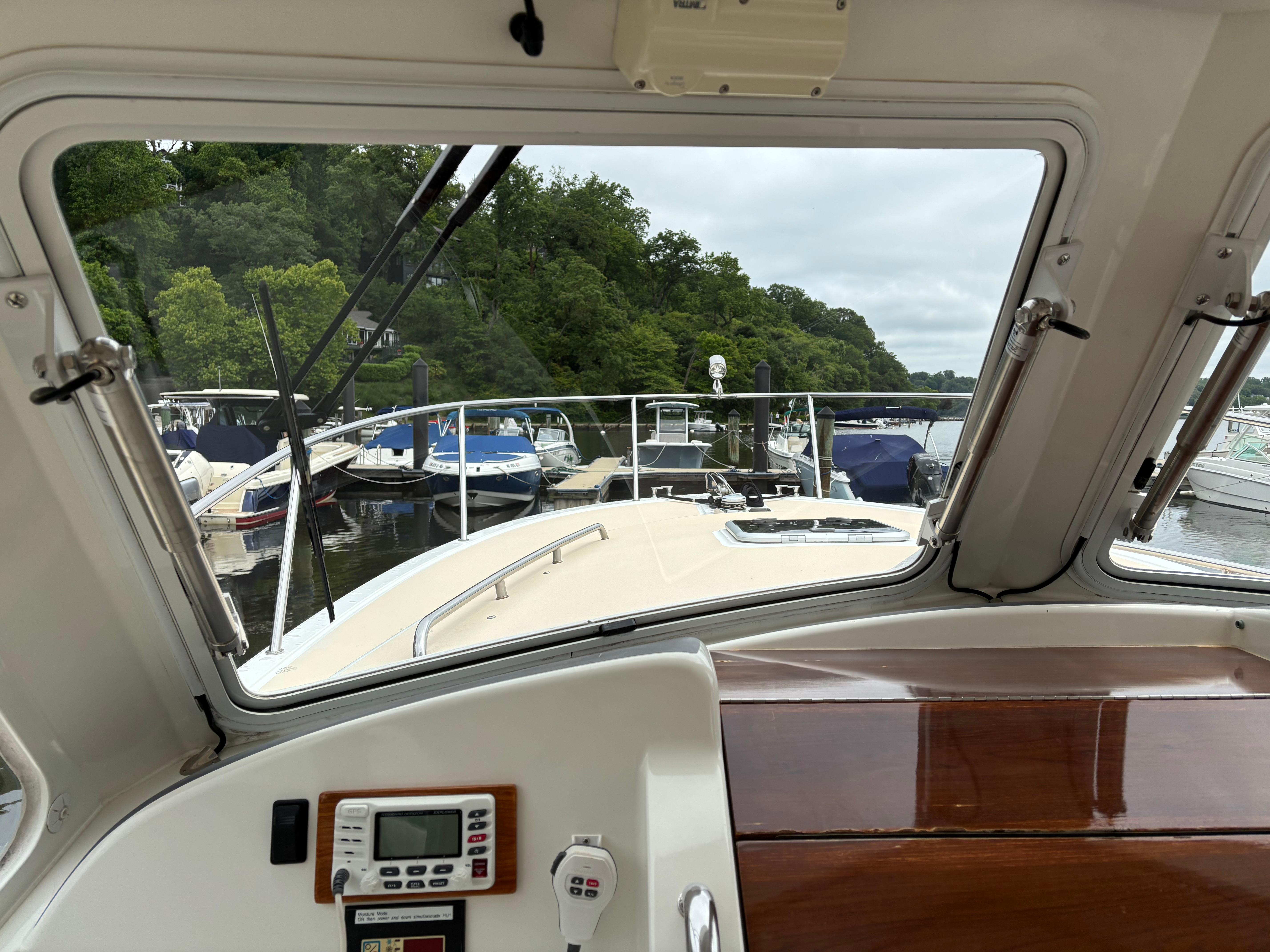 MJM-34z Express HT 2006-Zest MD-US-View from 2006 MJM 34z Express HT boat cockpit, overlooking marina with docked boats.-9817750 | Thumbnail