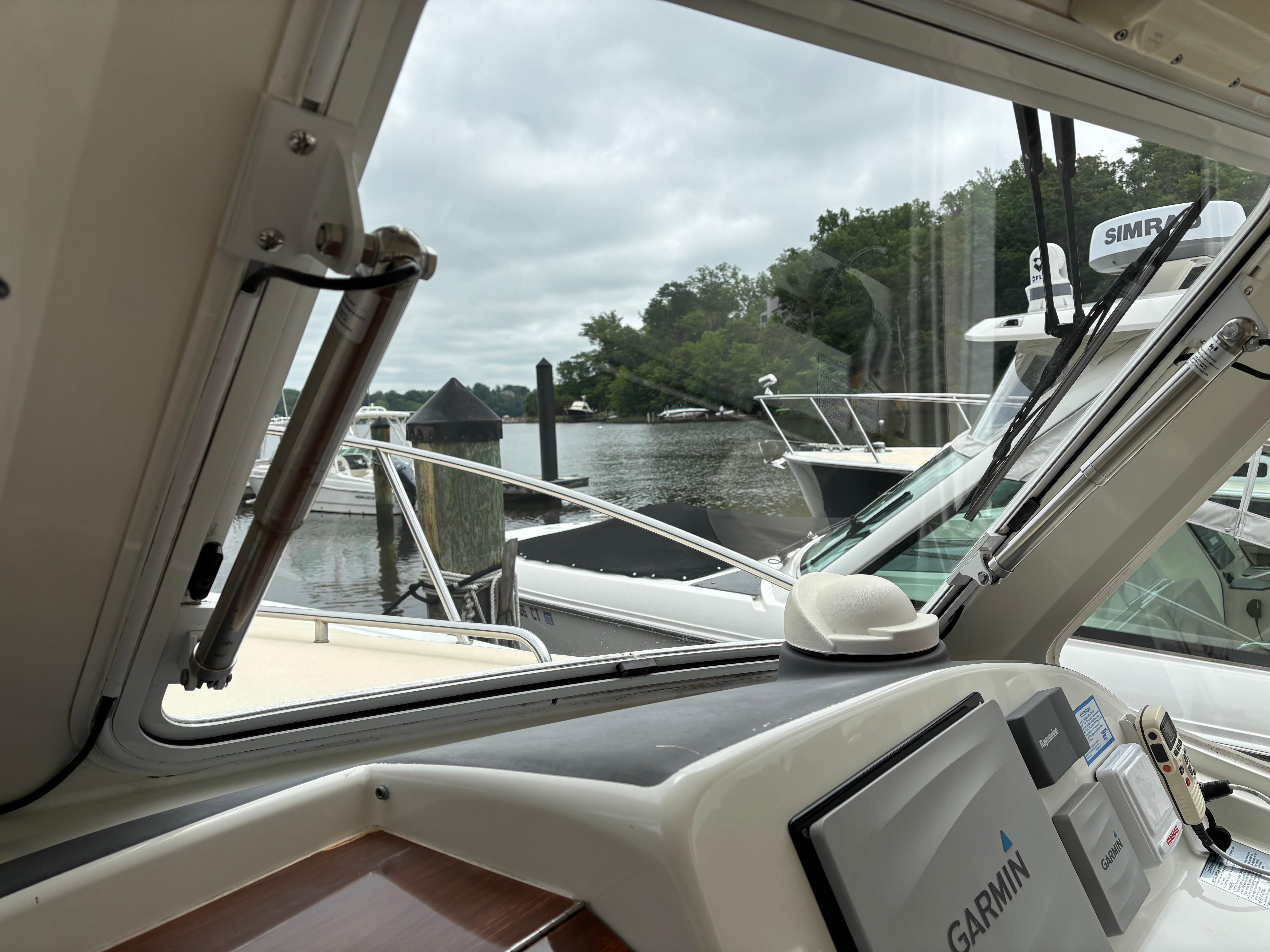MJM-34z Express HT 2006-Zest MD-US-2006 MJM 34z Express HT boat interior with Garmin navigation, docked by a serene waterfront.-9817750 | Thumbnail