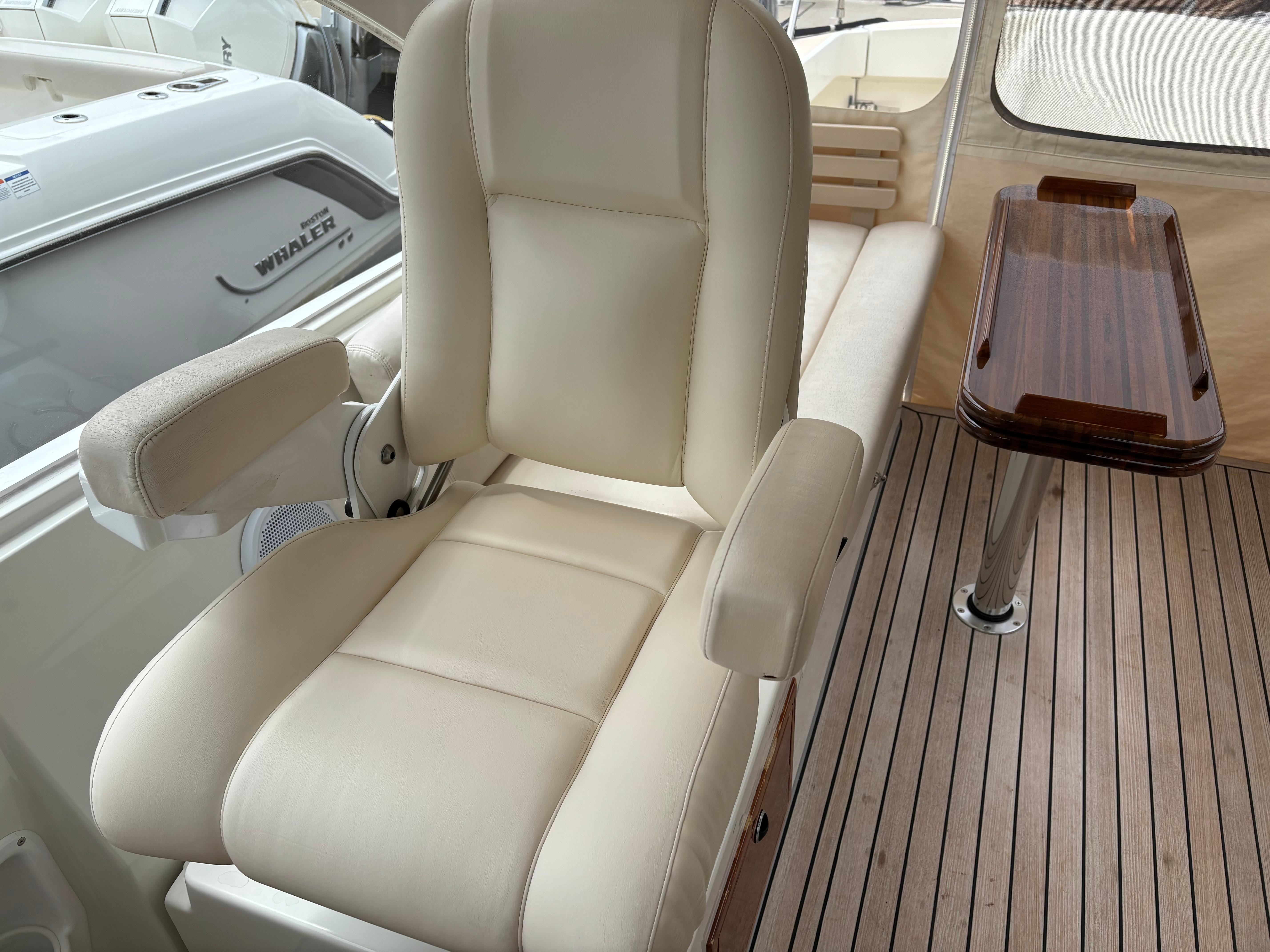 MJM-34z Express HT 2006-Zest MD-US-Luxurious seating on 2006 MJM 34z Express HT yacht with wooden table and deck.-9817750 | Thumbnail