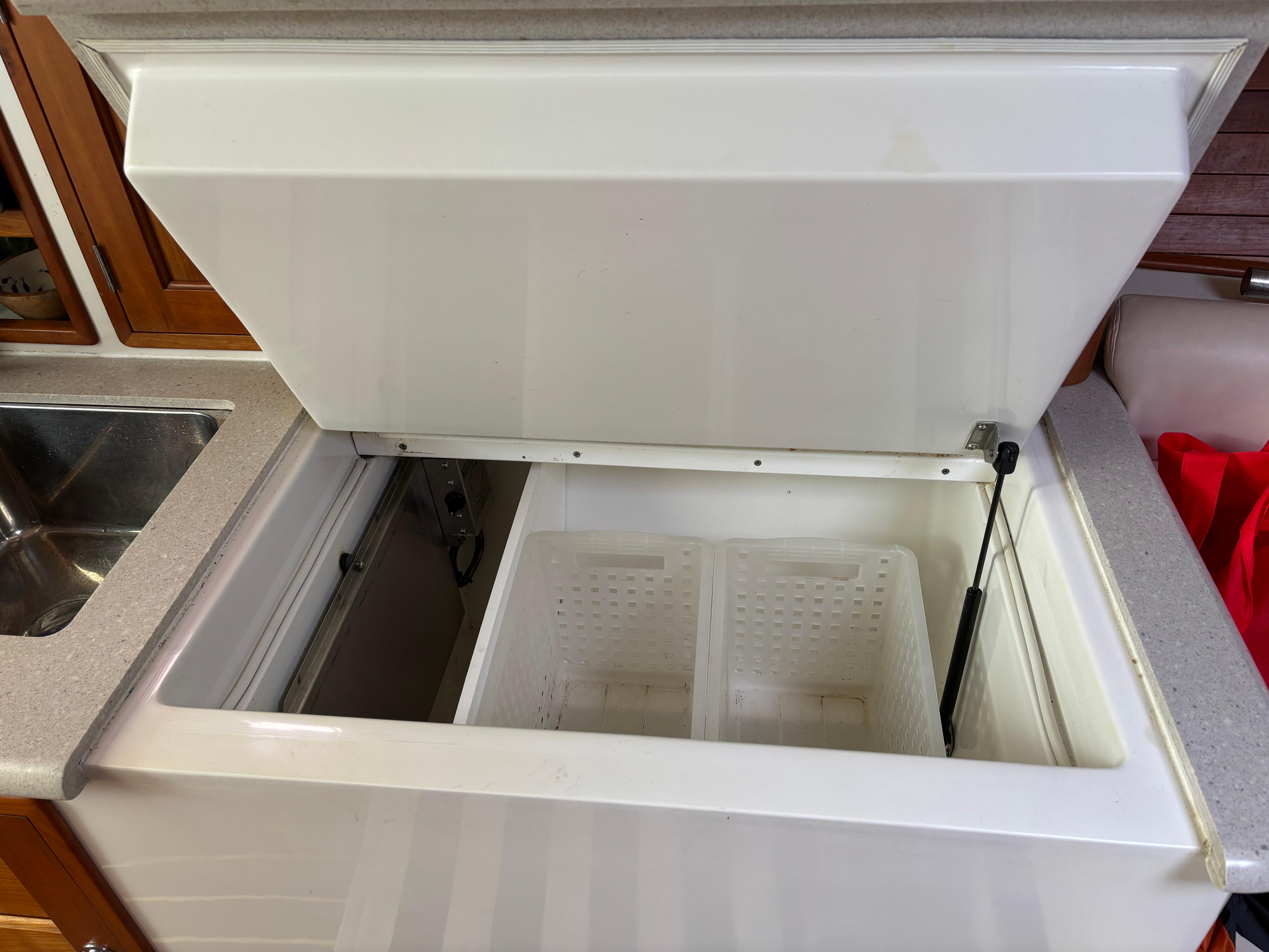 MJM-34z Express HT 2006-Zest MD-US-Open storage compartment on 2006 MJM 34z Express HT boat, featuring a white interior.-9817750 | Thumbnail