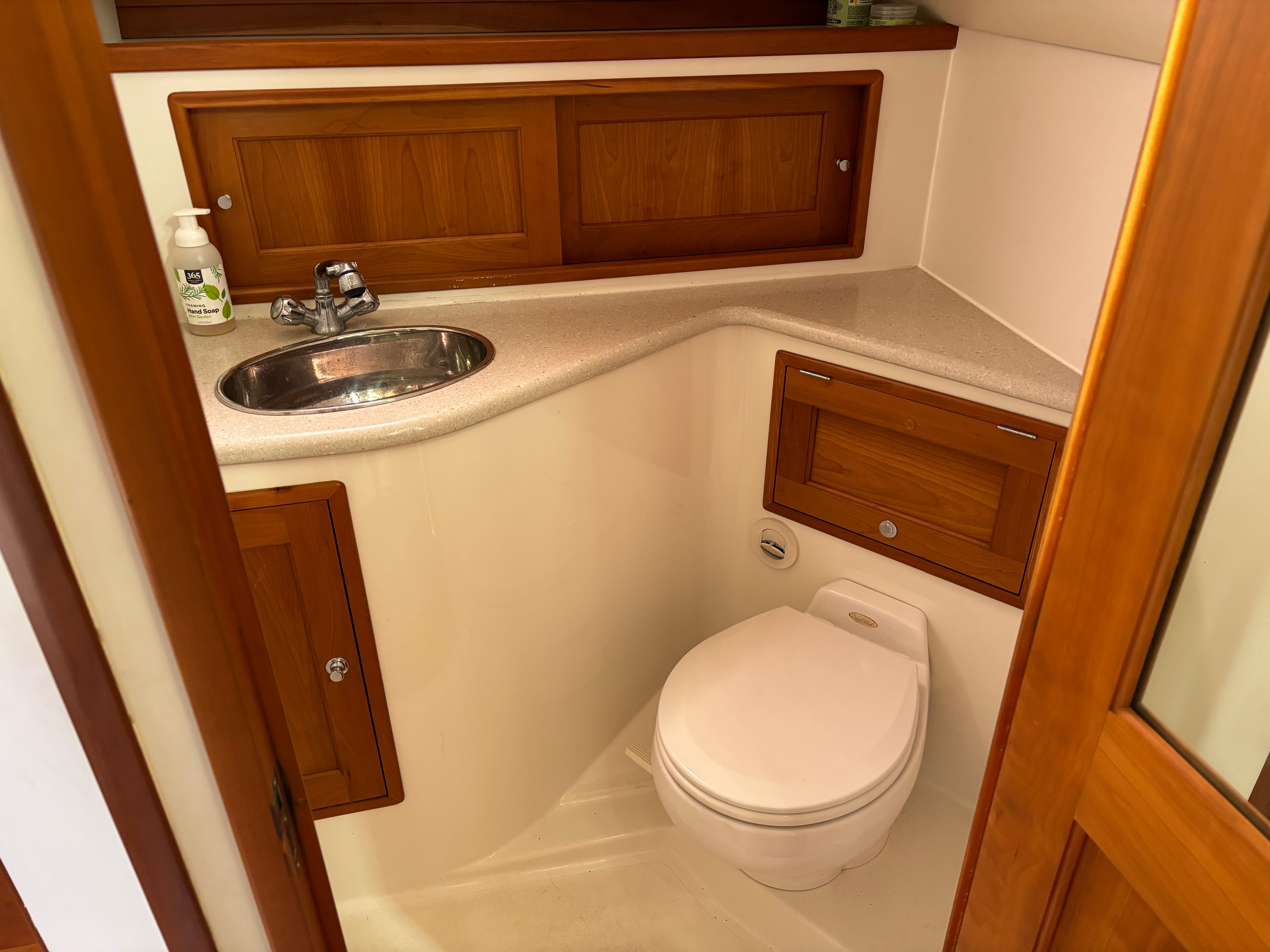 MJM-34z Express HT 2006-Zest MD-US-2006 MJM 34z Express HT boat bathroom with wooden cabinets and compact design.-9817750 | Thumbnail