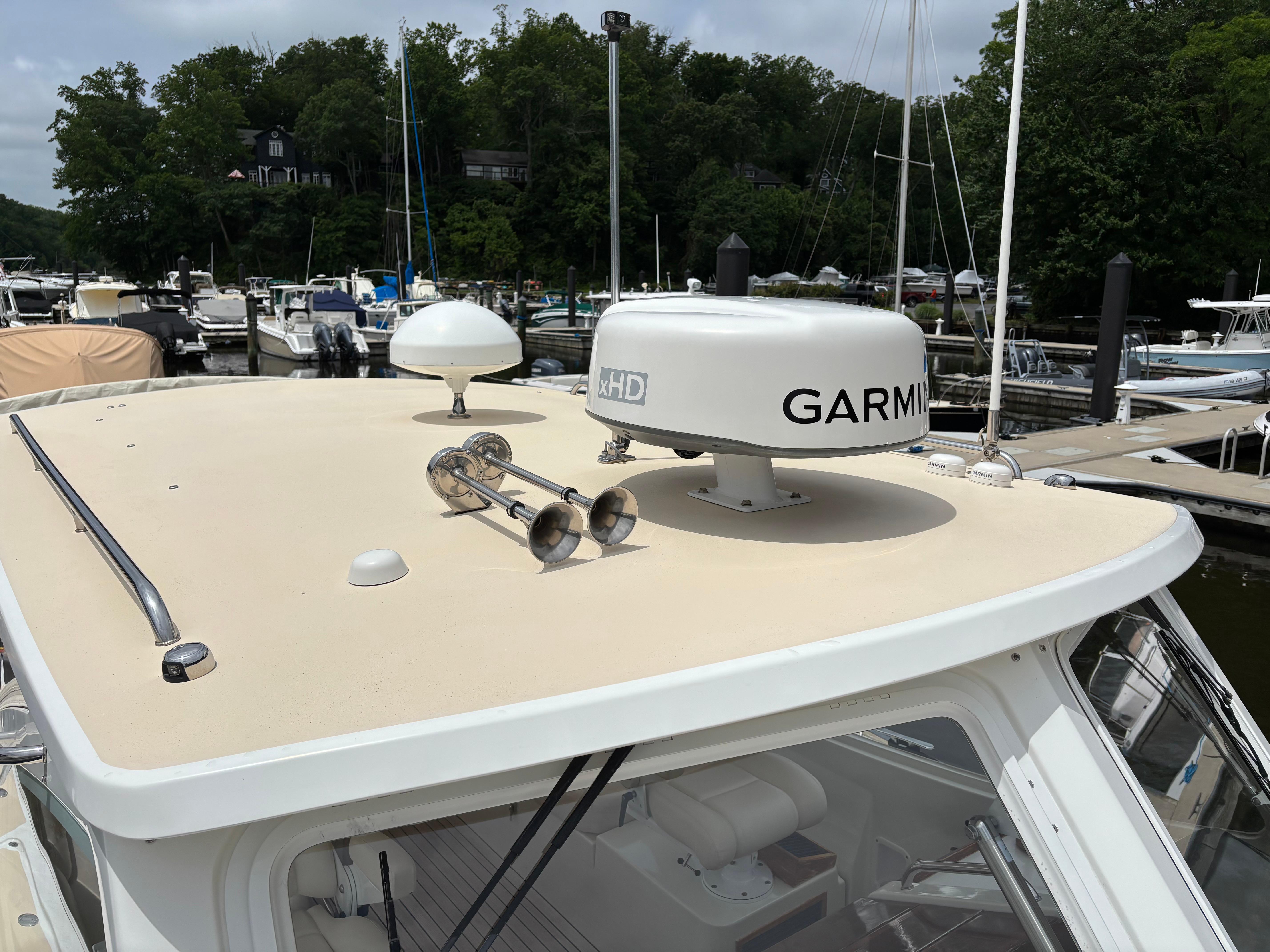 MJM-34z Express HT 2006-Zest MD-US-2006 MJM 34z Express HT boat with Garmin radar, docked in a marina.-9817750 | Thumbnail