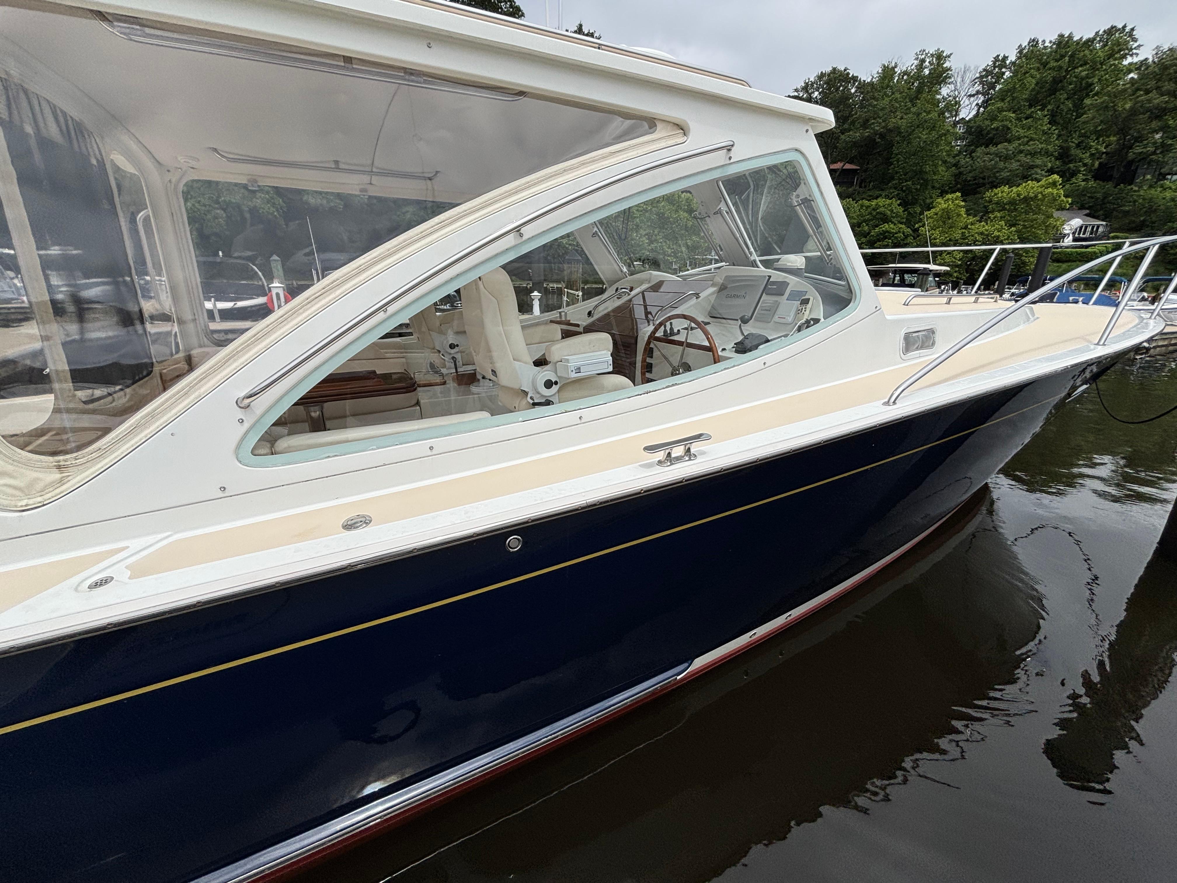 MJM-34z Express HT 2006-Zest MD-US-2006 MJM 34z Express HT boat docked on calm water, showcasing sleek design and spacious interior.-9817750 | Thumbnail