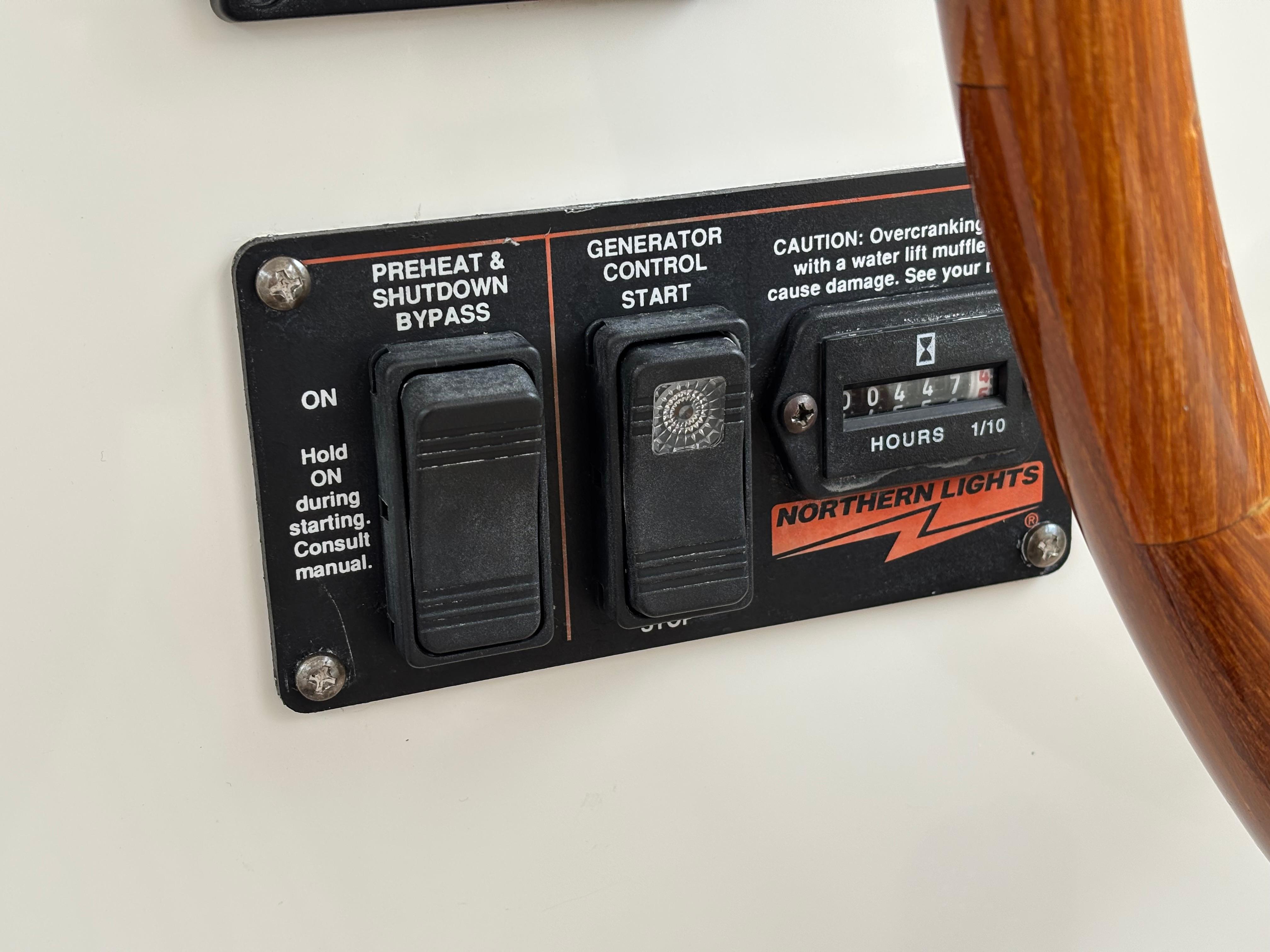MJM-34z Express HT 2006-Zest MD-US-Control panel of a 2006 MJM 34z Express HT boat with generator switches.-9817750 | Thumbnail