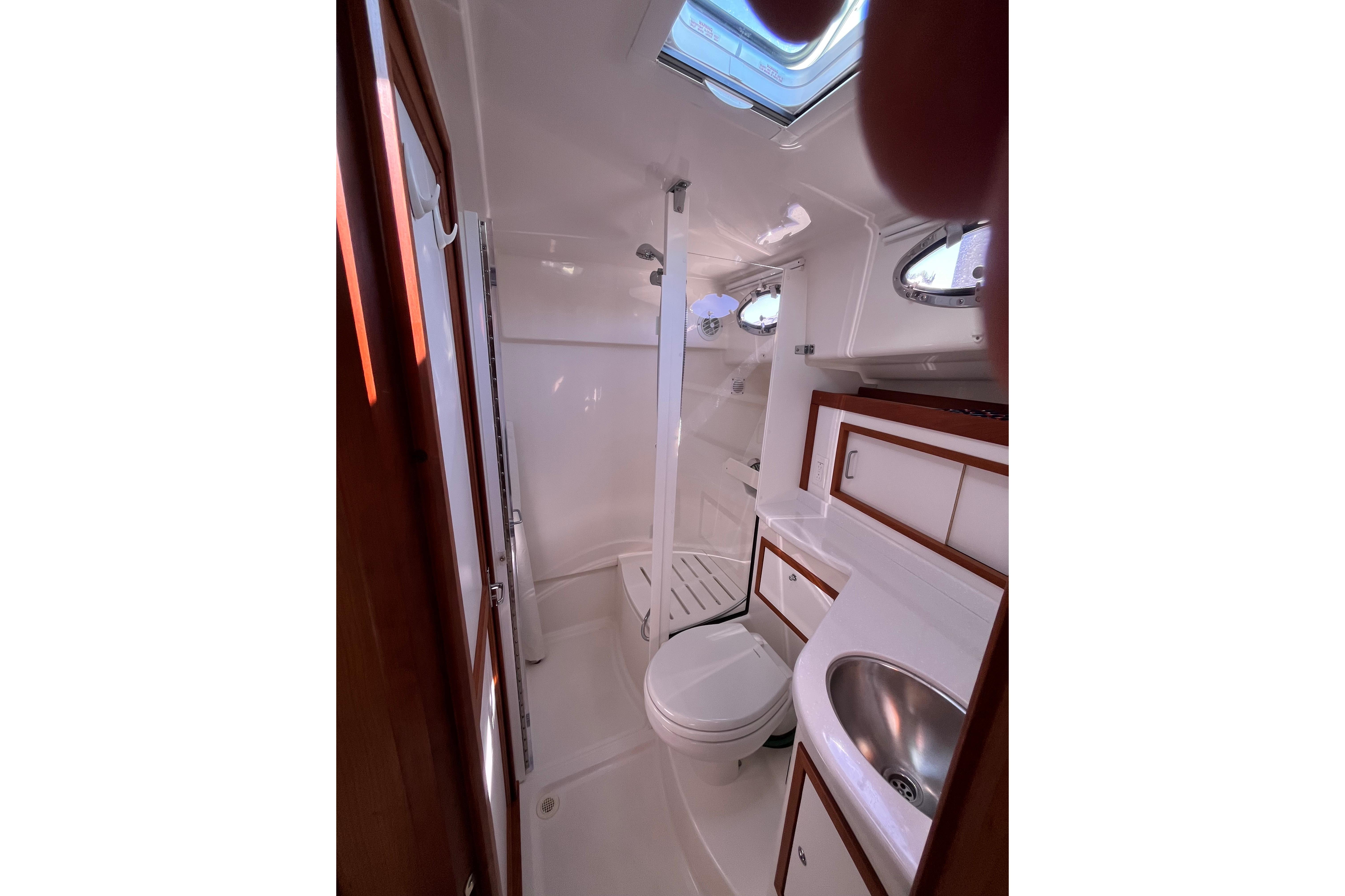 2017 Back Cove 37 yacht bathroom with shower, sink, and toilet.