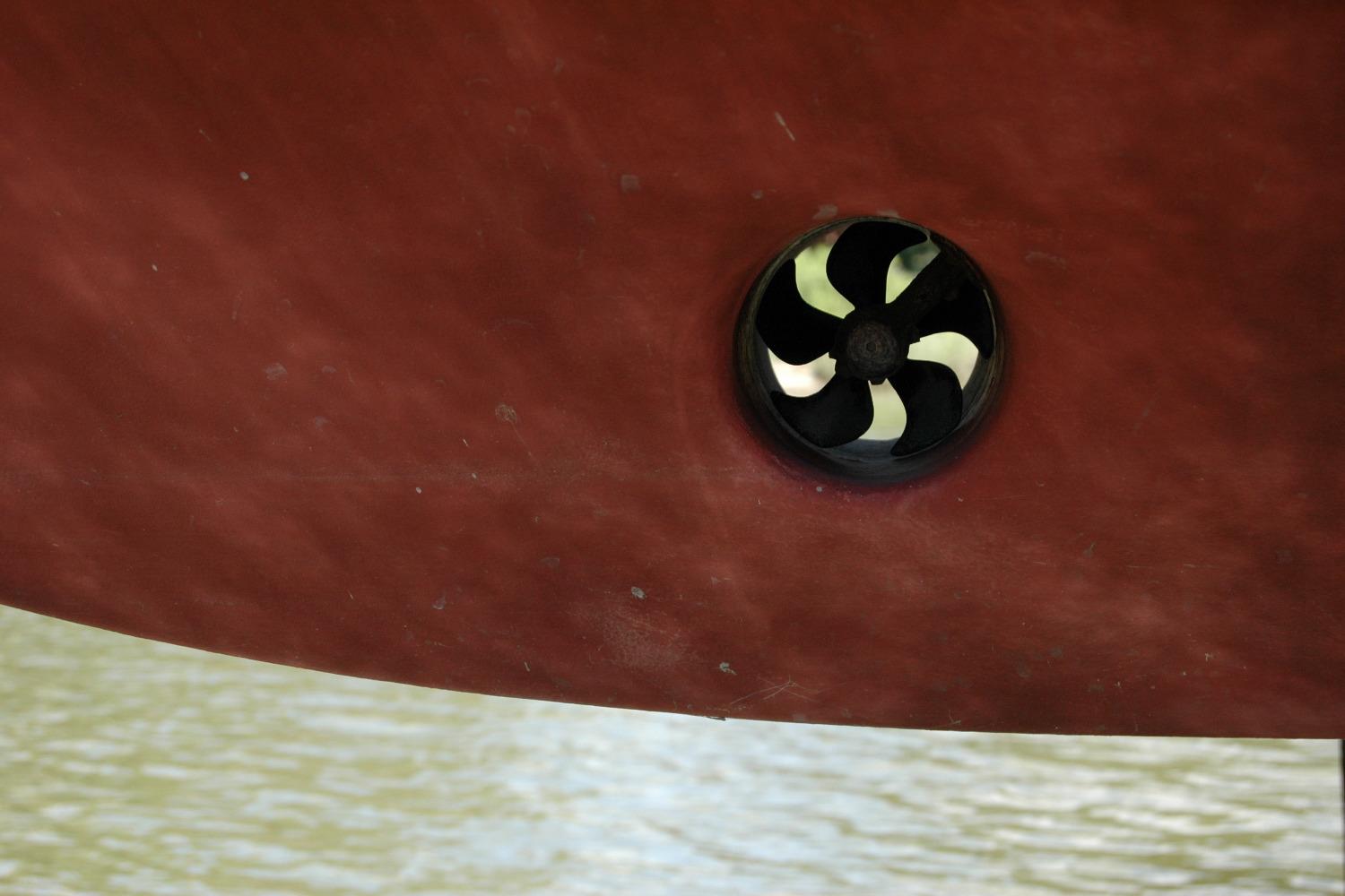 Close-up of a 2013 Composite Yacht 26 hull with a visible propeller.