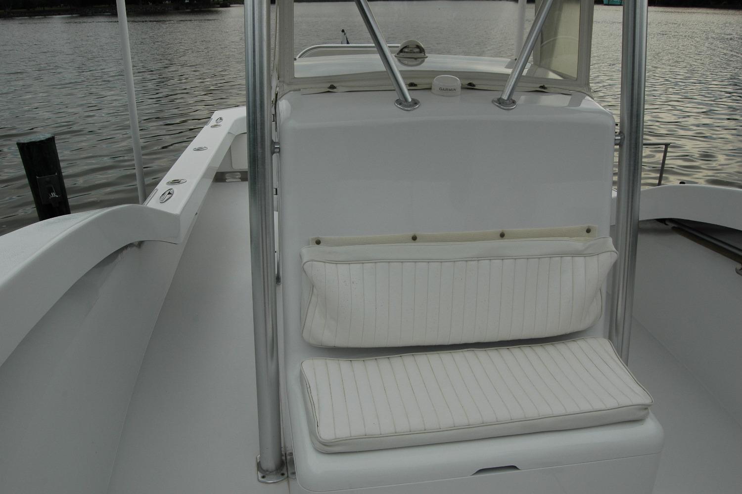 2013 Composite Yacht 26 interior with white seating, sleek design, and water view.