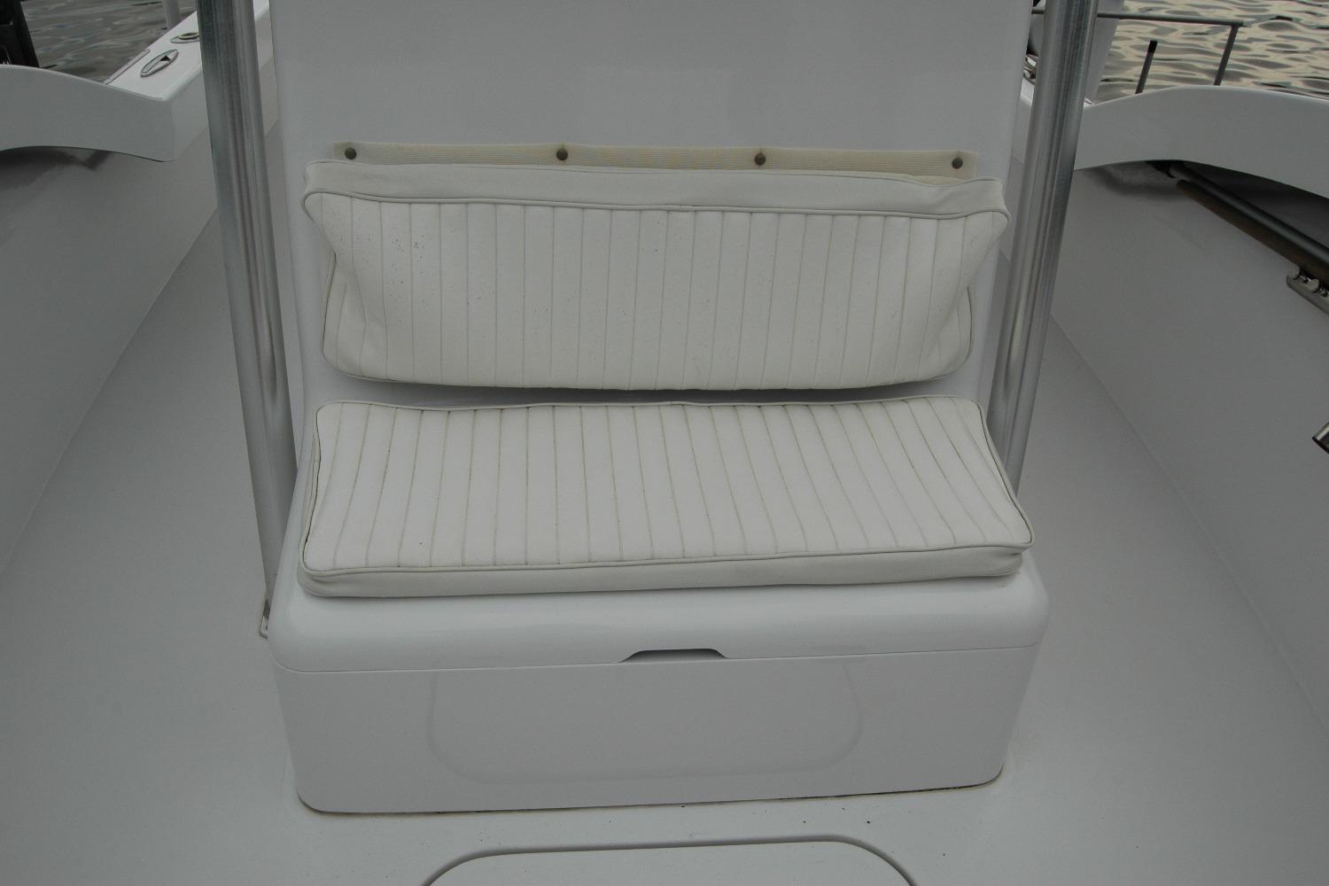 White cushioned seating on 2013 Composite Yacht 26, featuring sleek design and comfort.
