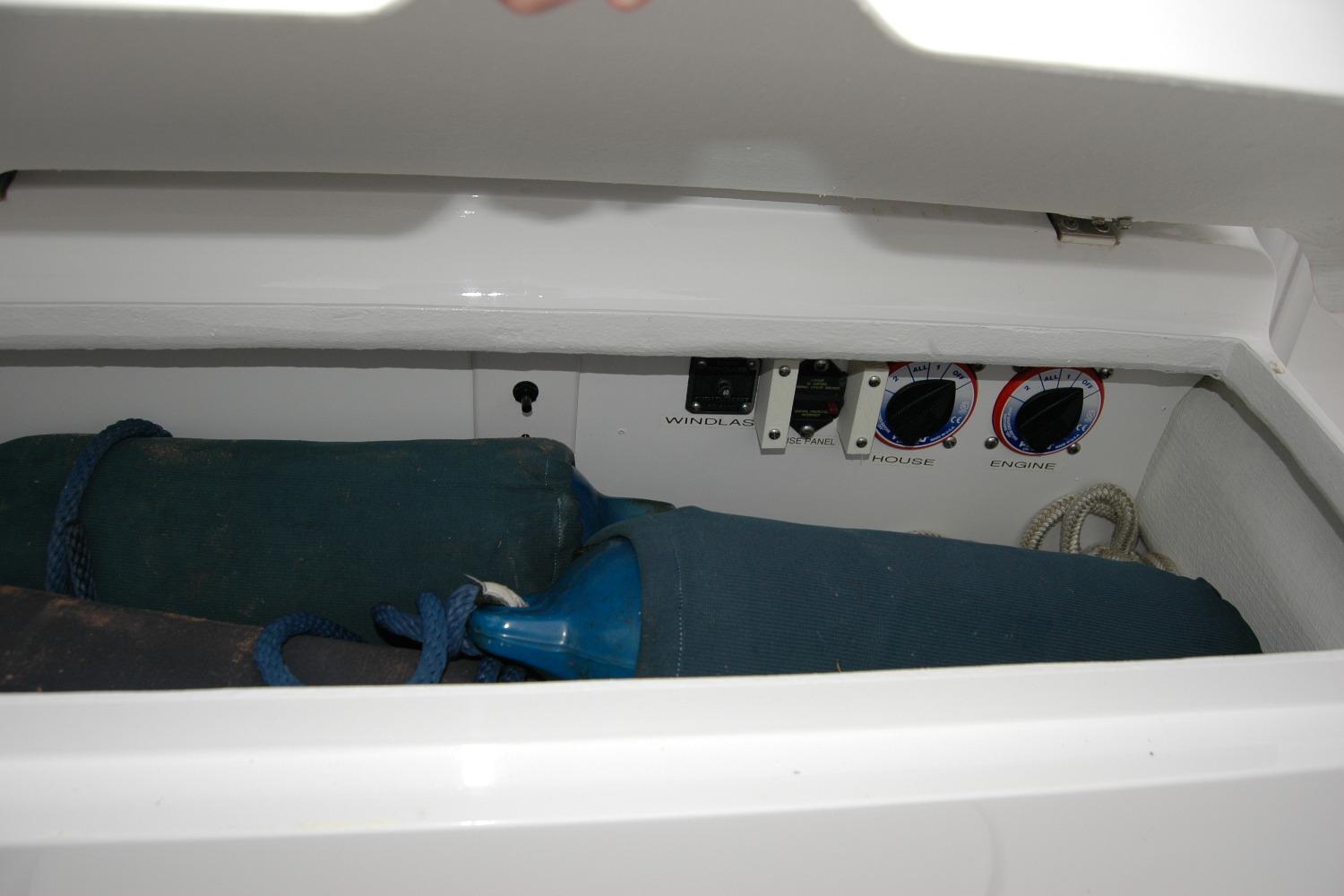 Storage compartment in a 2013 Composite Yacht 26, featuring controls and equipment.