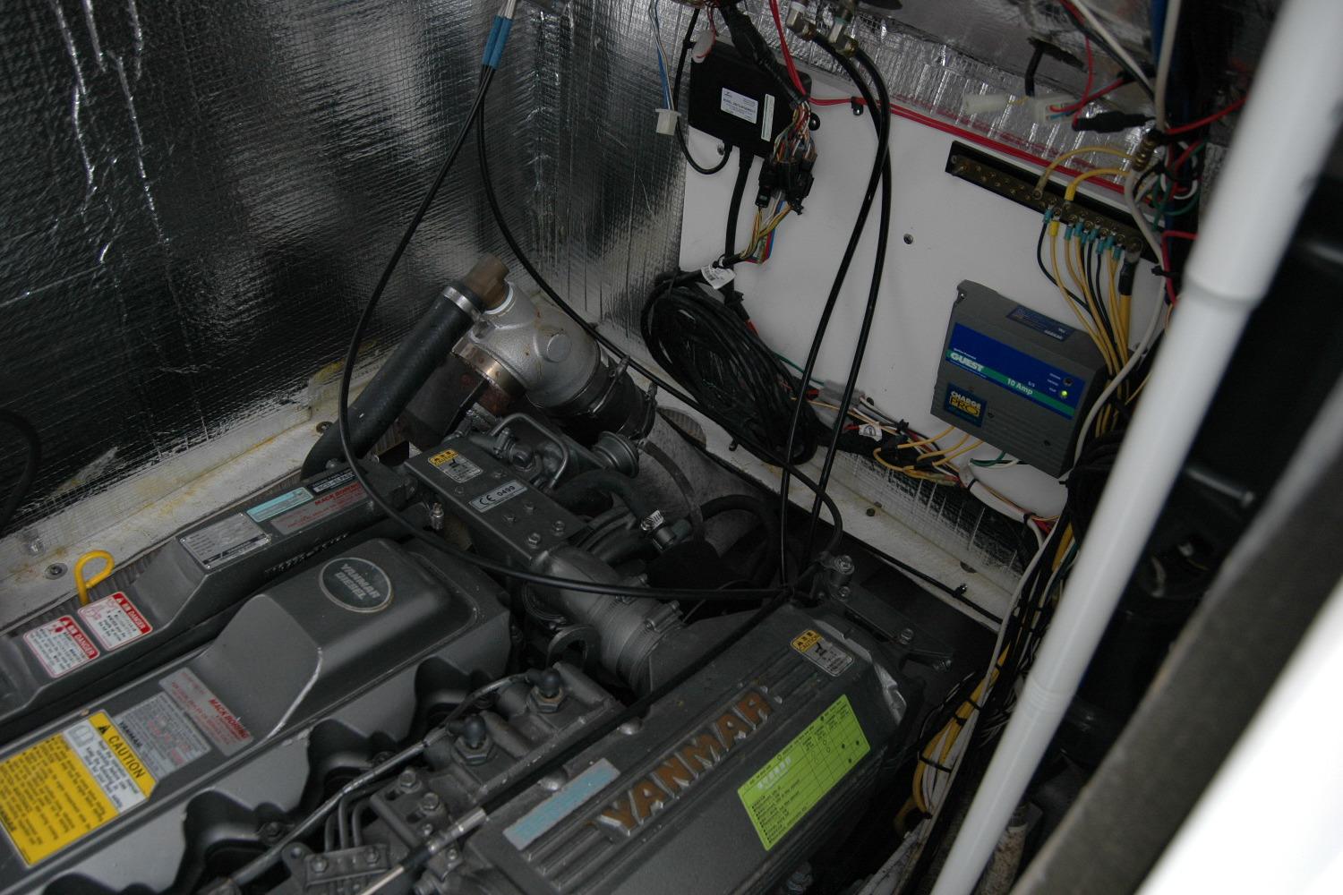 Engine room of 2013 Composite Yacht 26 with Yanmar engine and electrical components.