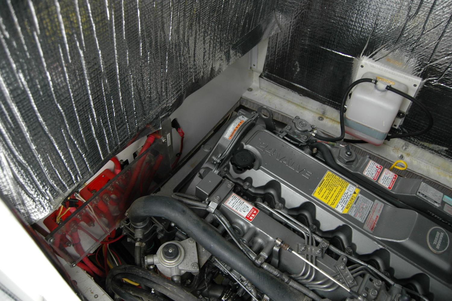 Engine compartment of 2013 Composite Yacht 26, showcasing detailed mechanical components.