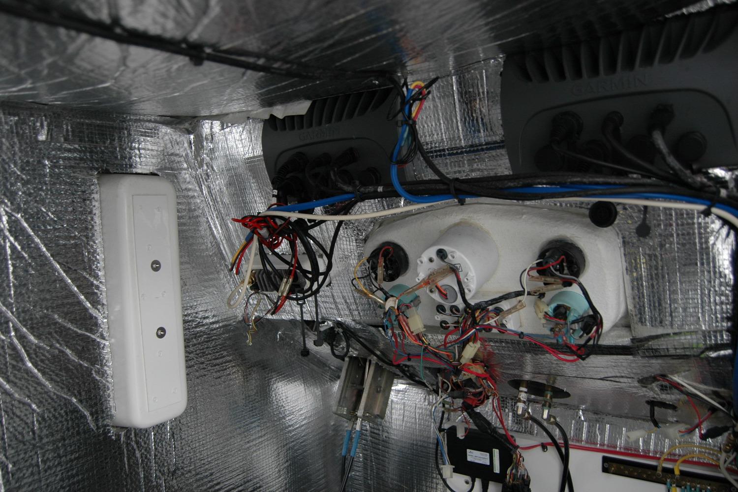 Electrical wiring and components inside a 2013 Composite Yacht 26, with reflective insulation.