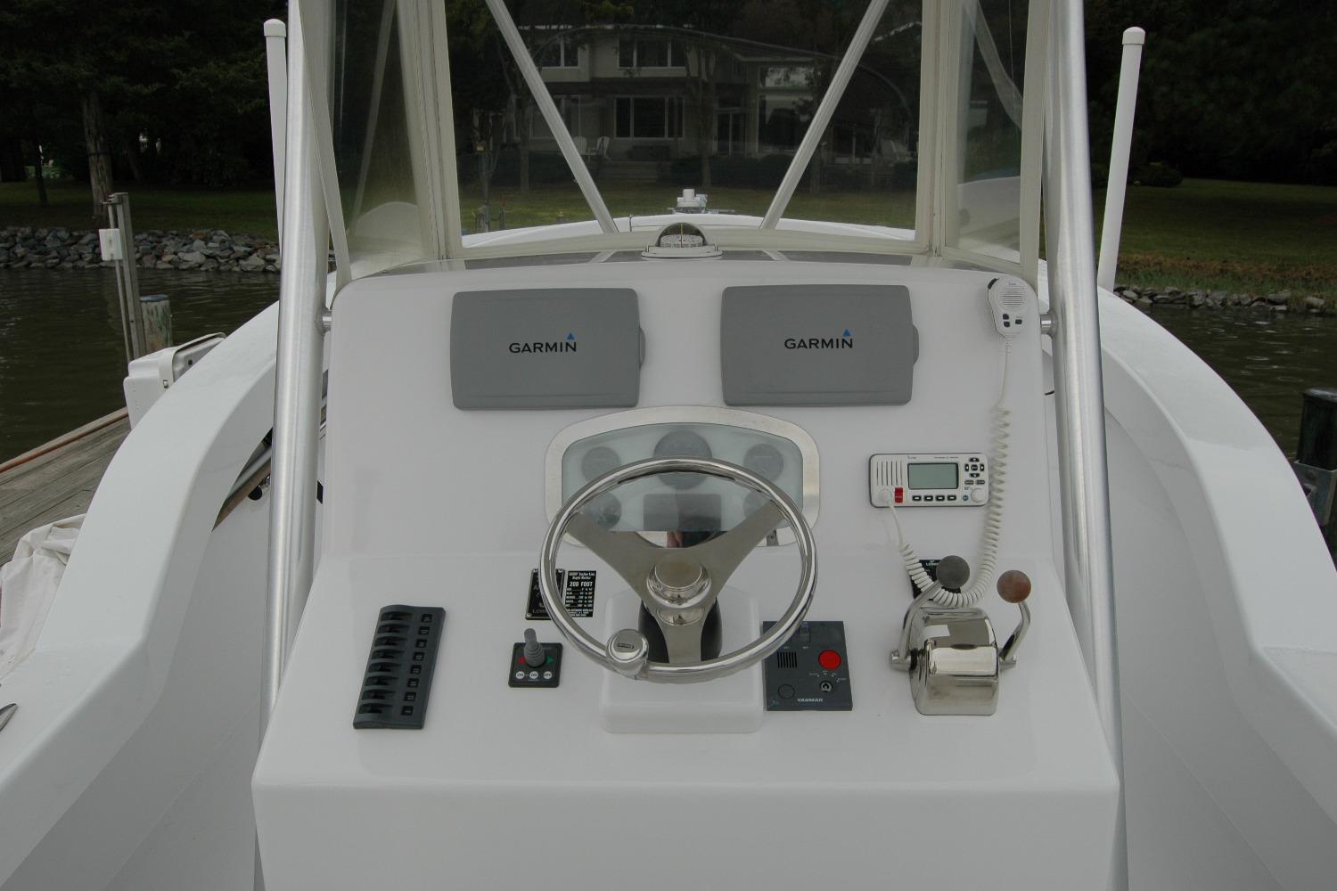 Steering console of 2013 Composite Yacht 26 with Garmin navigation equipment.