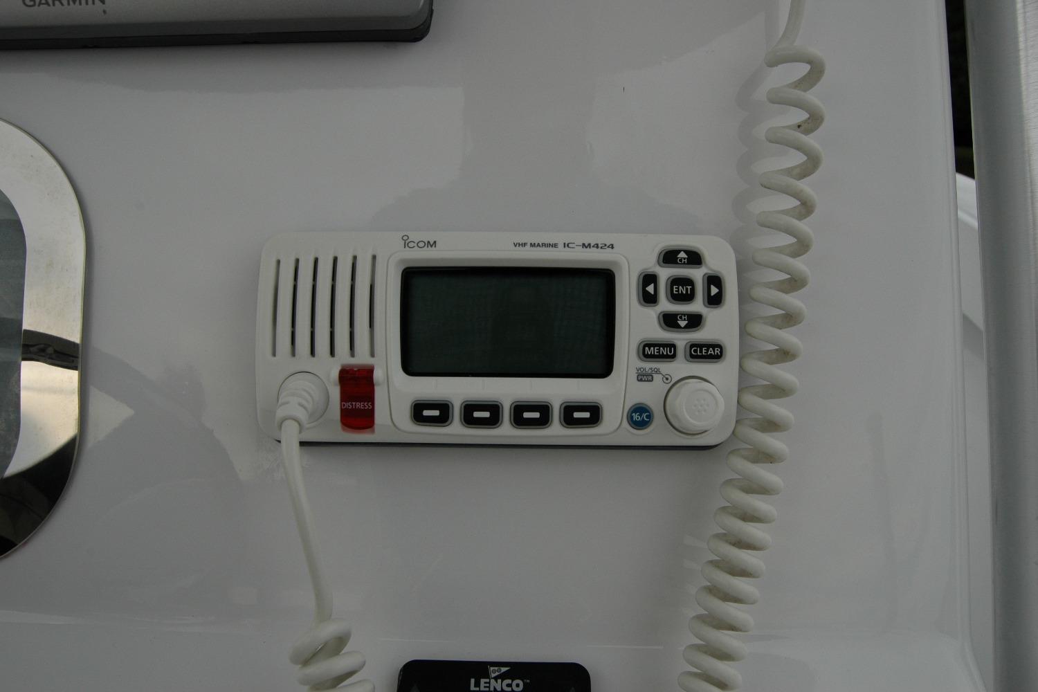 VHF marine radio on 2013 Composite Yacht 26 dashboard, featuring Icom IC-M424 model.