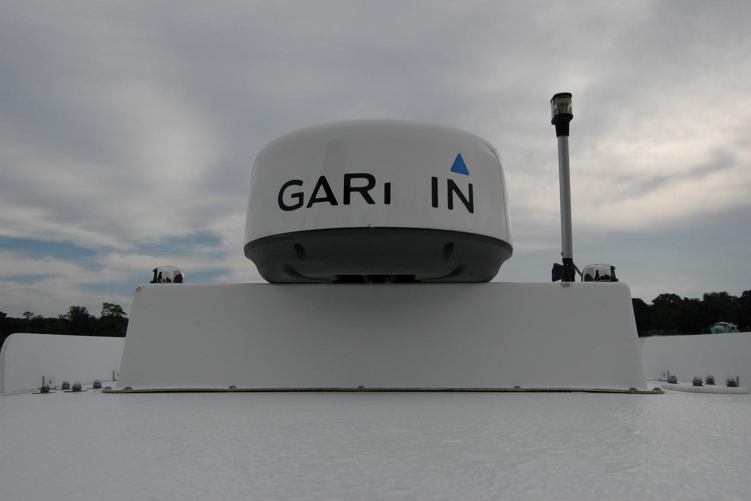 Garmin radar on 2013 Composite Yacht 26 under cloudy sky.